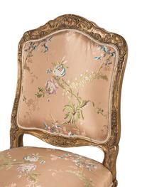 A Set of Ten Régence Style Giltwood Dining Chairs