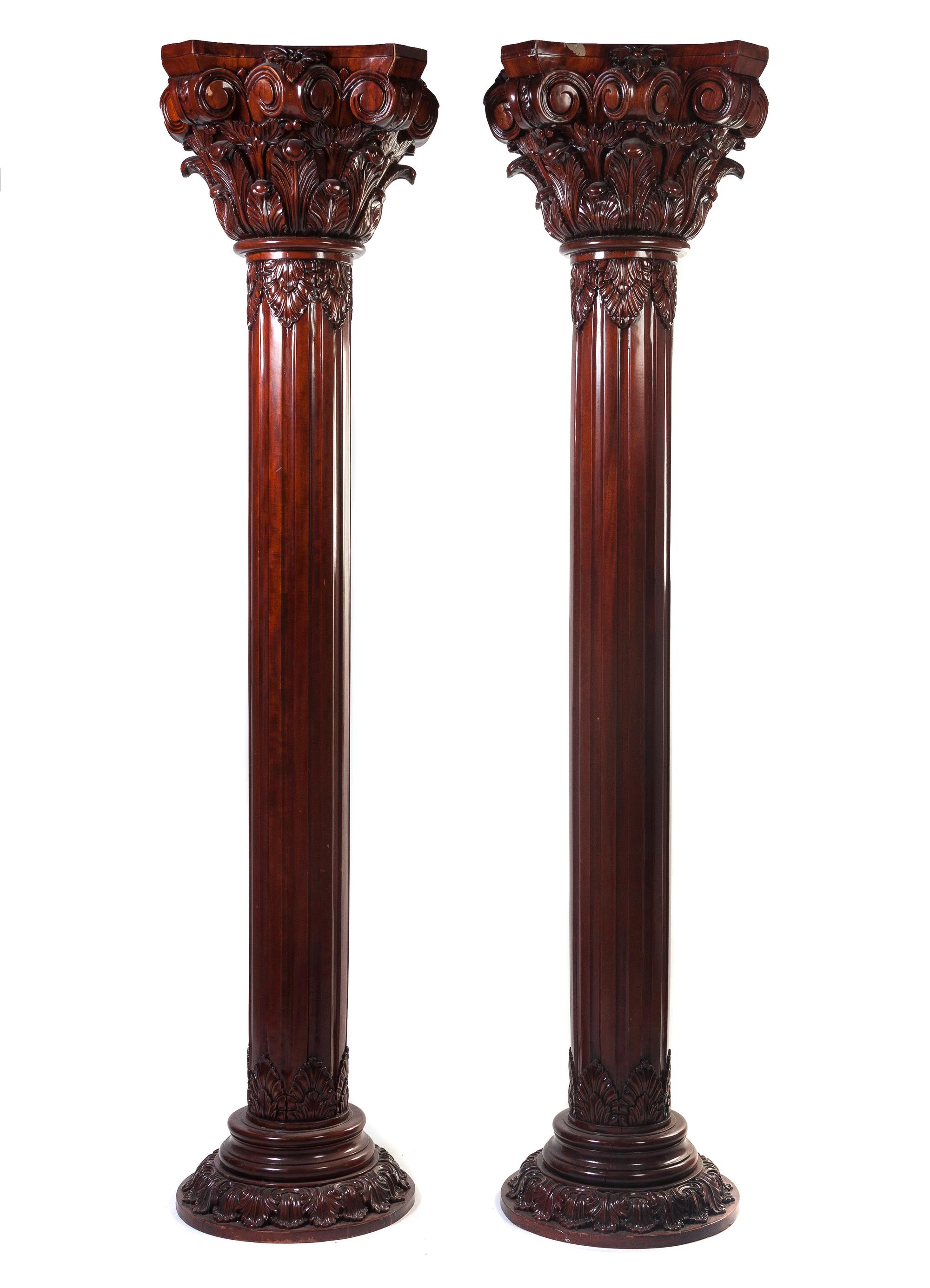 A Pair of Neoclassical Style Carved Mahogany Columns, Height 98 inches.