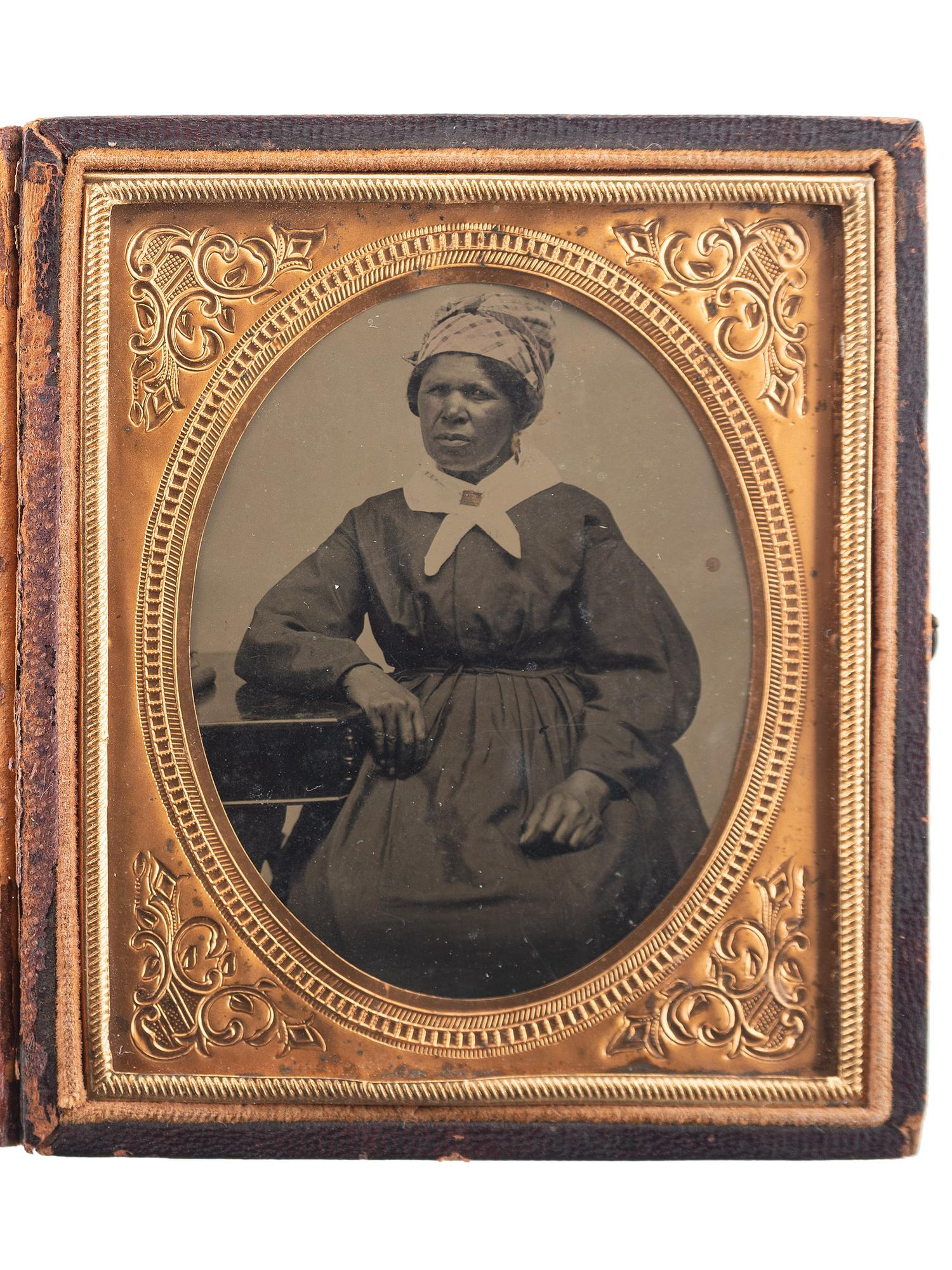 [EARLY PHOTOGRAPHY]. Sixth plate tintype portrait of an African American woman. Ca 1870s.