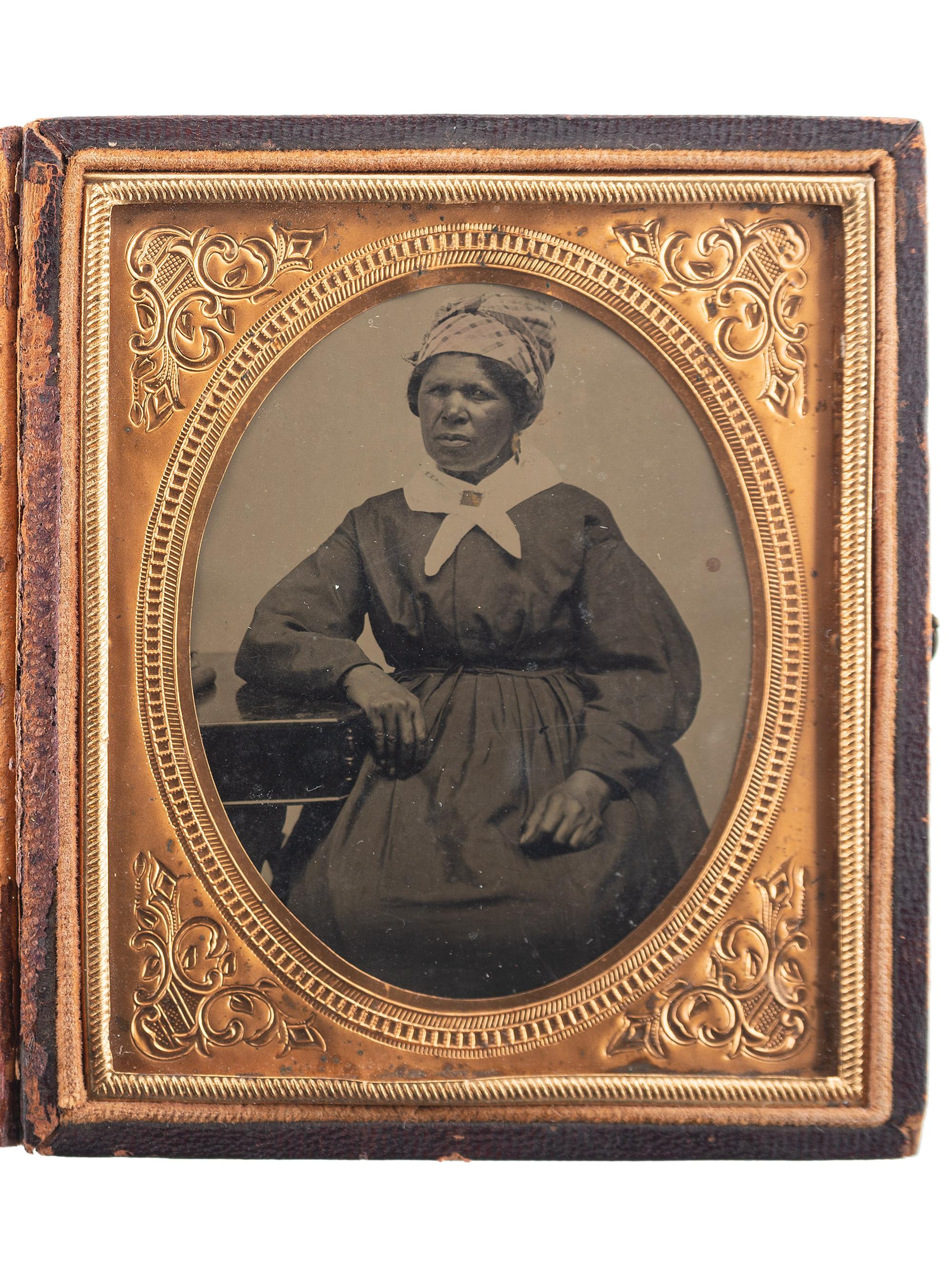 [EARLY PHOTOGRAPHY]. Sixth plate tintype portrait of an African American woman. Ca 1870s.