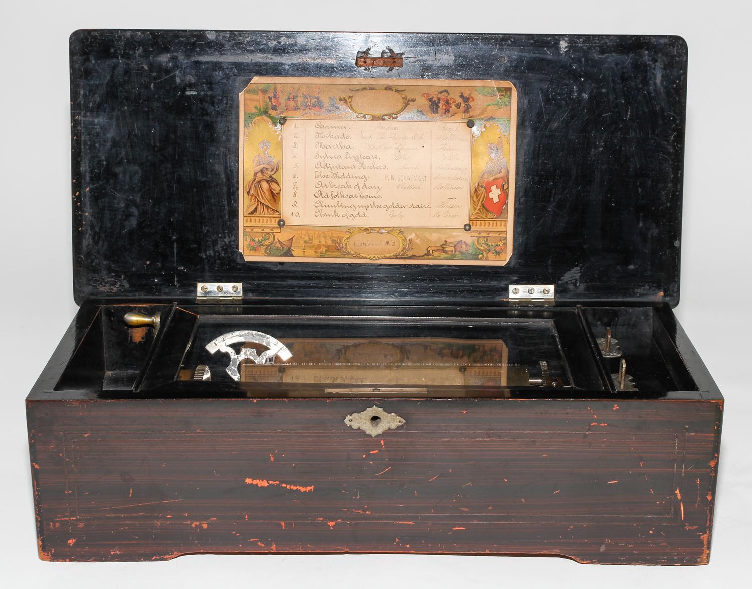 A Continental Cylinder Music Box. Height 6 x width 18 1/2 x depth 8 1/2 inches.