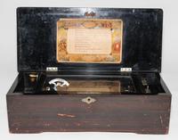 A Continental Cylinder Music Box. Height 6 x width 18 1/2 x depth 8 1/2 inches.