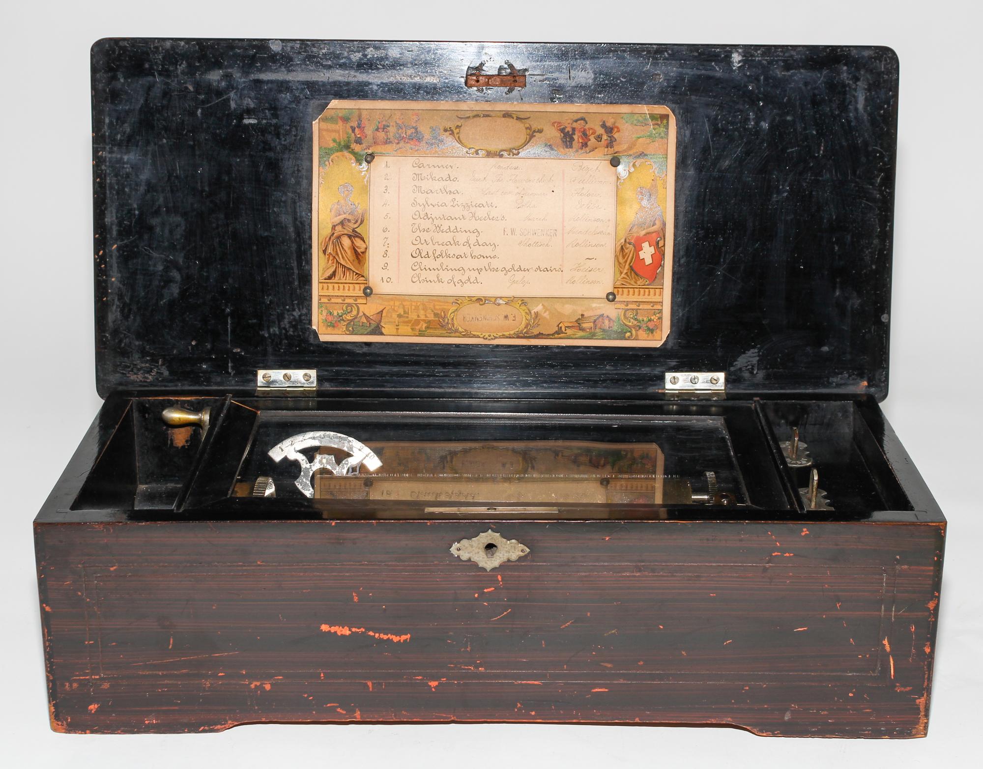 A Continental Cylinder Music Box. Height 6 x width 18 1/2 x depth 8 1/2 inches.