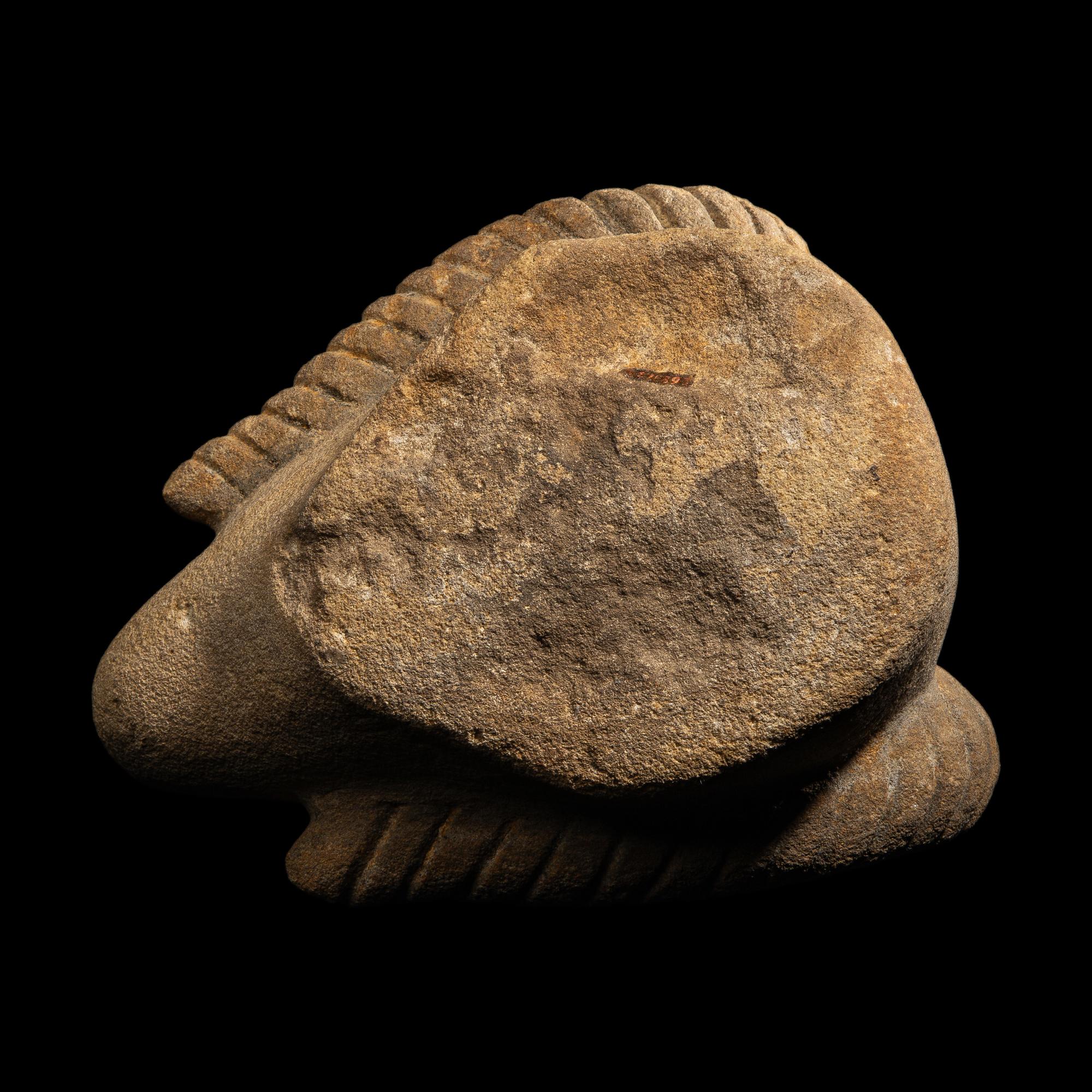 A Romano-Egyptian Style Sandstone Head of a Ram