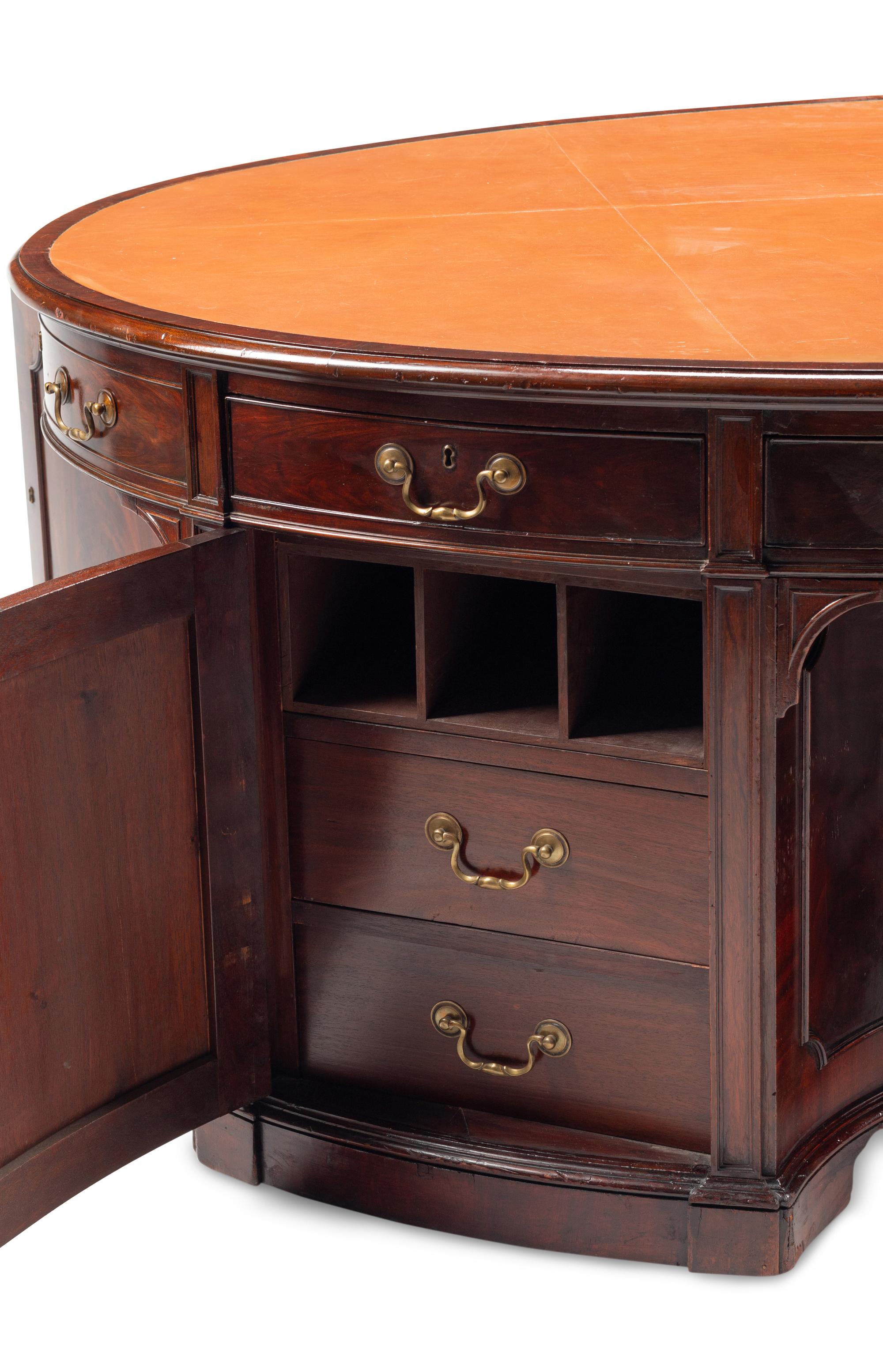 An English Mahogany Oval Partners Desk