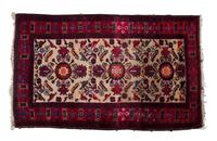 A Sarouk Wool Rug 4 feet 11 x 3 feet 1/2 inches.
