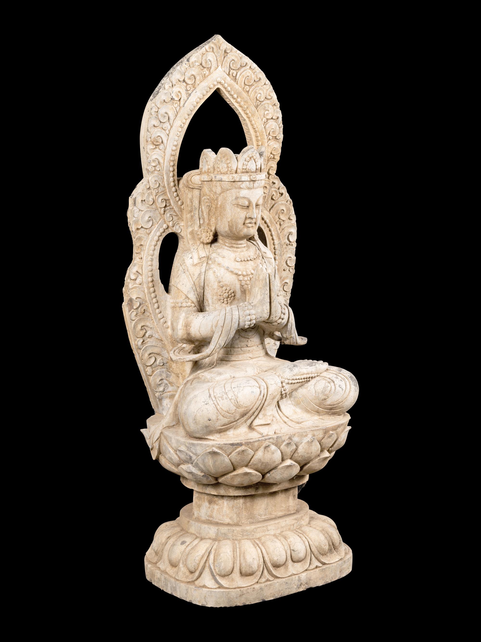 A Chinese Carved Stone Seated Guanyin Figure