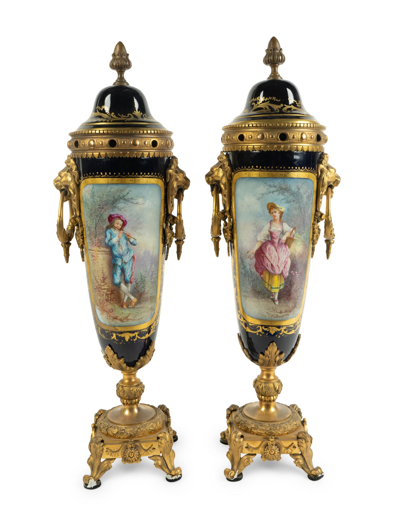 A Pair of Gilt Bronze Mounted Sèvres Style Porcelain Covered Urns — 19TH CENTURY