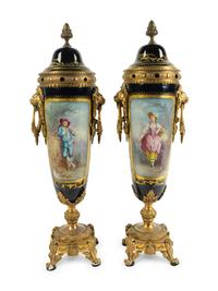A Pair of Gilt Bronze Mounted Sèvres Style Porcelain Covered Urns — 19TH CENTURY