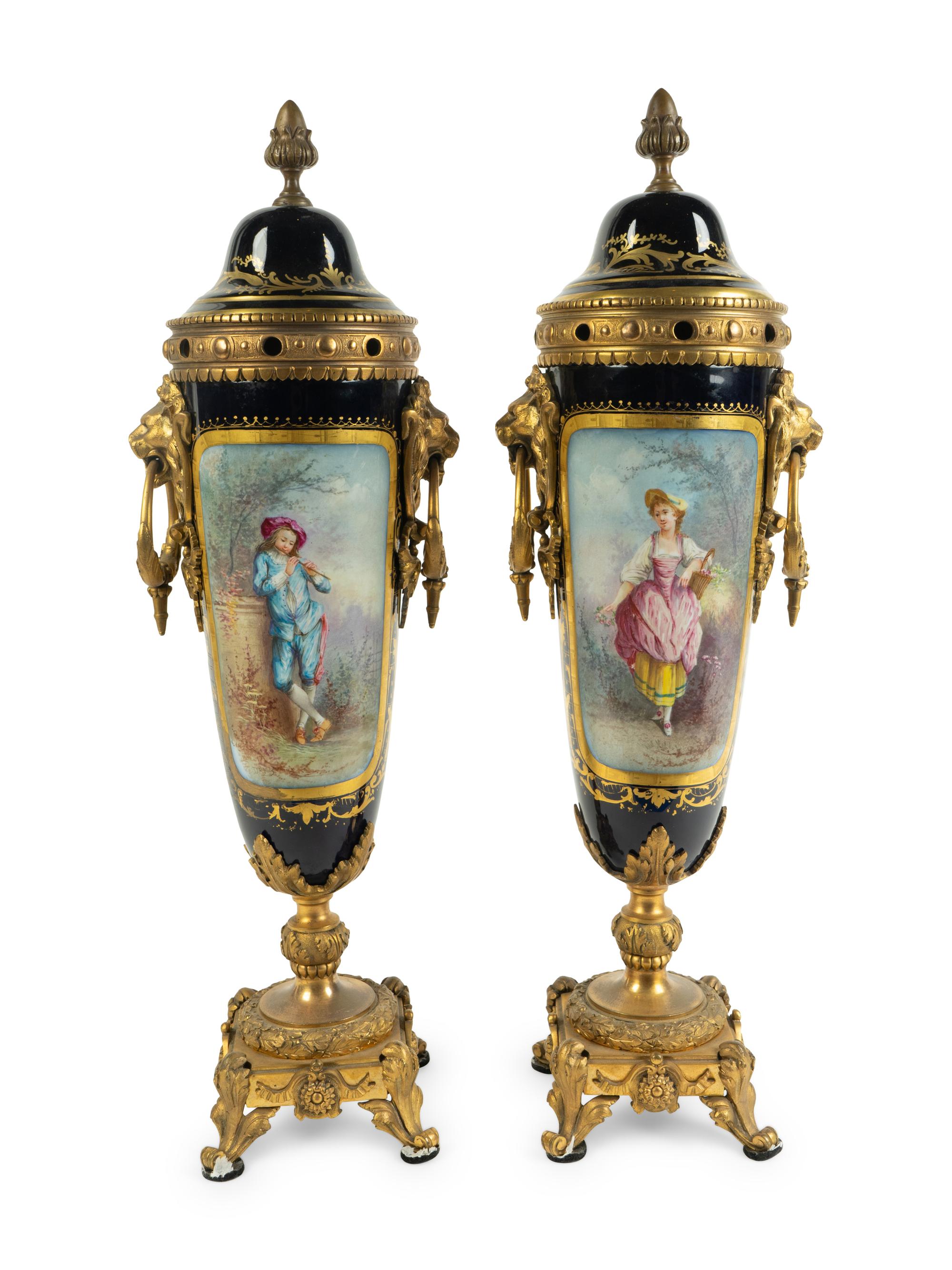 A Pair of Gilt Bronze Mounted Sèvres Style Porcelain Covered Urns — 19TH CENTURY