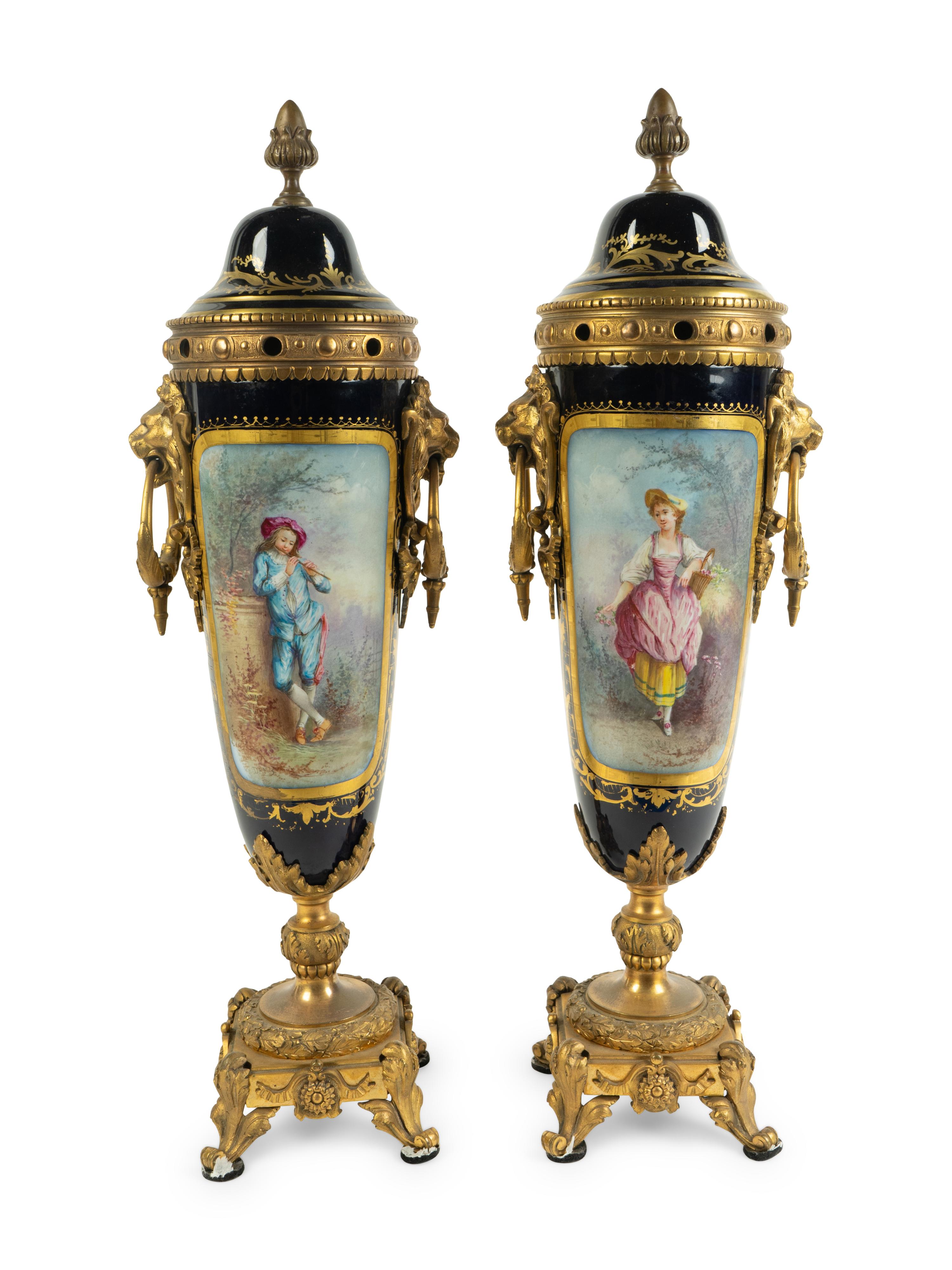 A Pair of Gilt Bronze Mounted Sèvres Style Porcelain Covered Urns — 19TH CENTURY