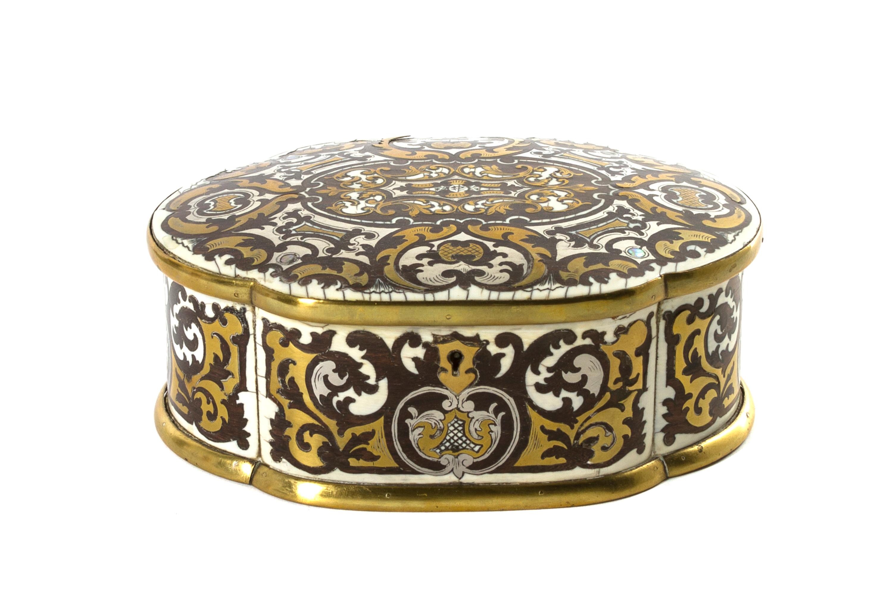 A Continental Ivory, Brass and Pewter Inlaid Table Casket, Width 6 3/4 inches.