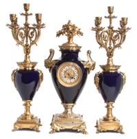 A French Blue Porcelain and Gilt Bronze Clock Garniture Height 23 x width 7 x depth 11 inches. — 19TH/20TH CENTURY