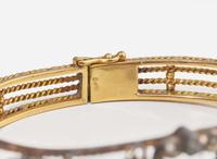 A Silver-Topped Yellow Gold, Diamond, and Emerald Bracelet