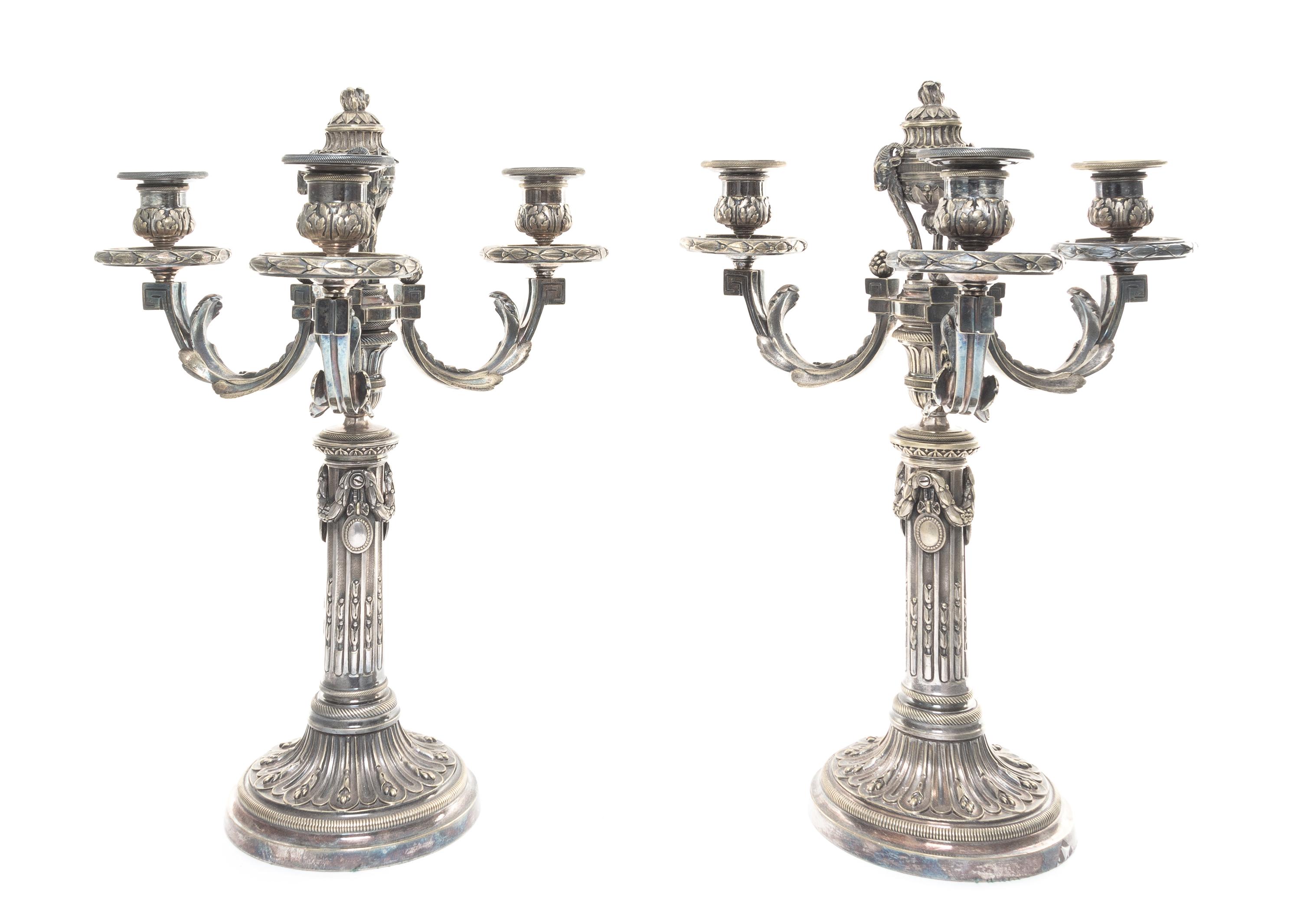 A Pair of Continental Silvered Bronze Three-Light Candelabra Height 16 1/2 inches.