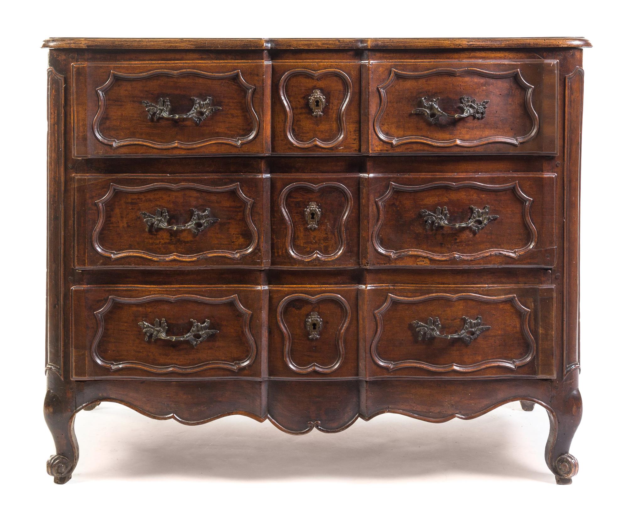 A Louis XV Provincial Walnut Commode Height 38 1/2 x width 48 1/4 x depth 23 inches. — 18TH CENTURY