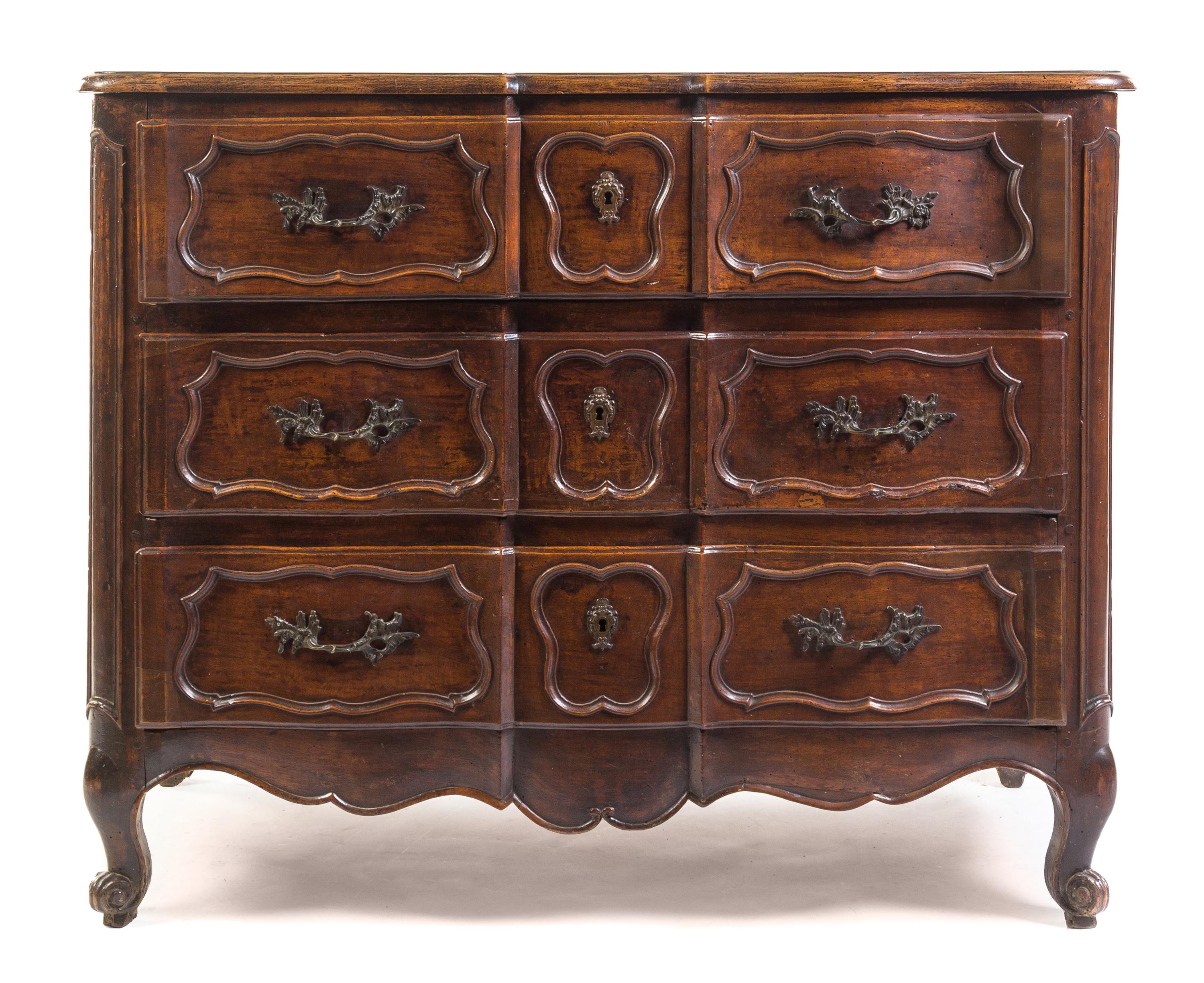 A Louis XV Provincial Walnut Commode Height 38 1/2 x width 48 1/4 x depth 23 inches. — 18TH CENTURY