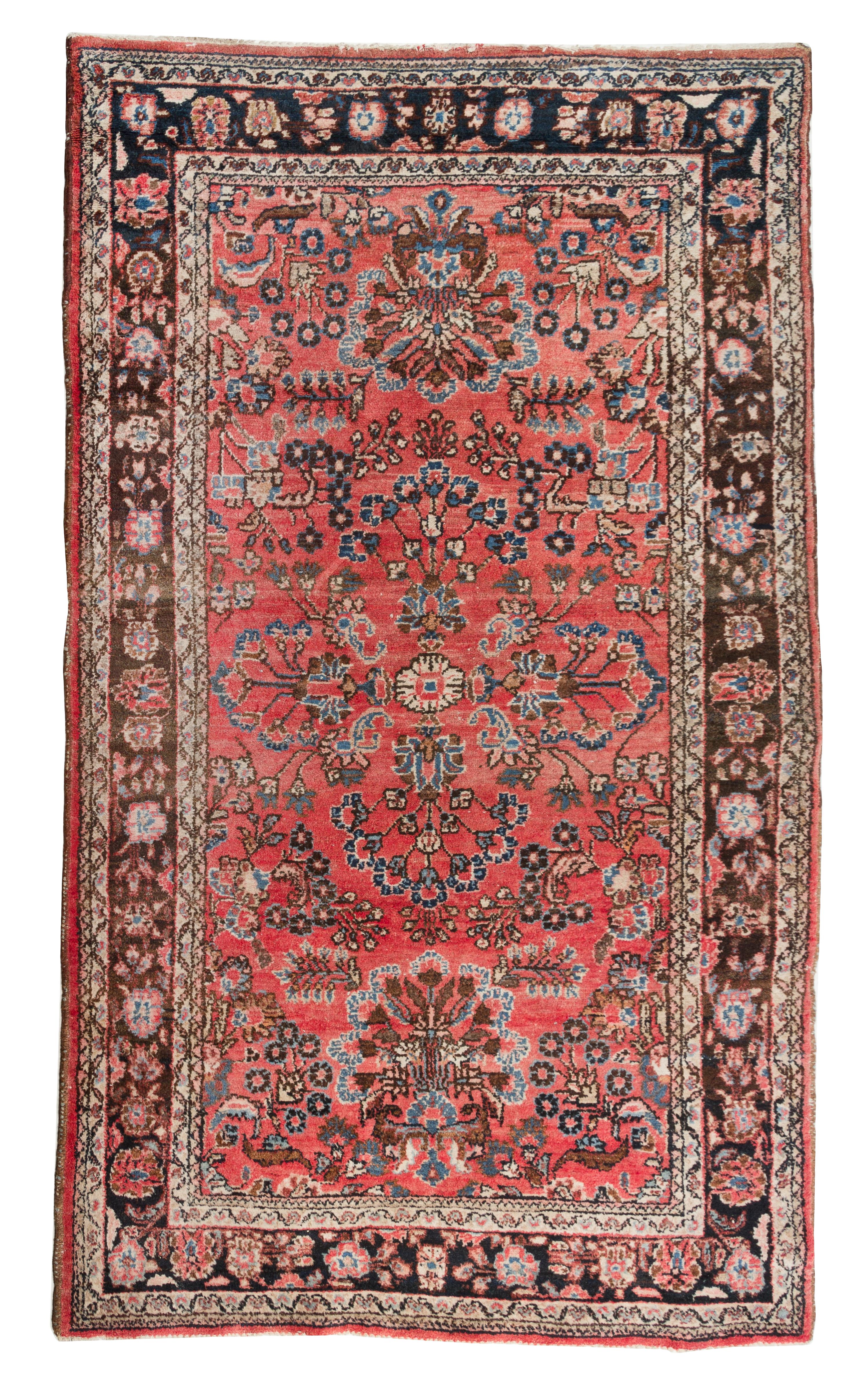 A Sarouk Wool Rug 7 feet 3 1/2 inches x 4 feet 4 3/4 inches.