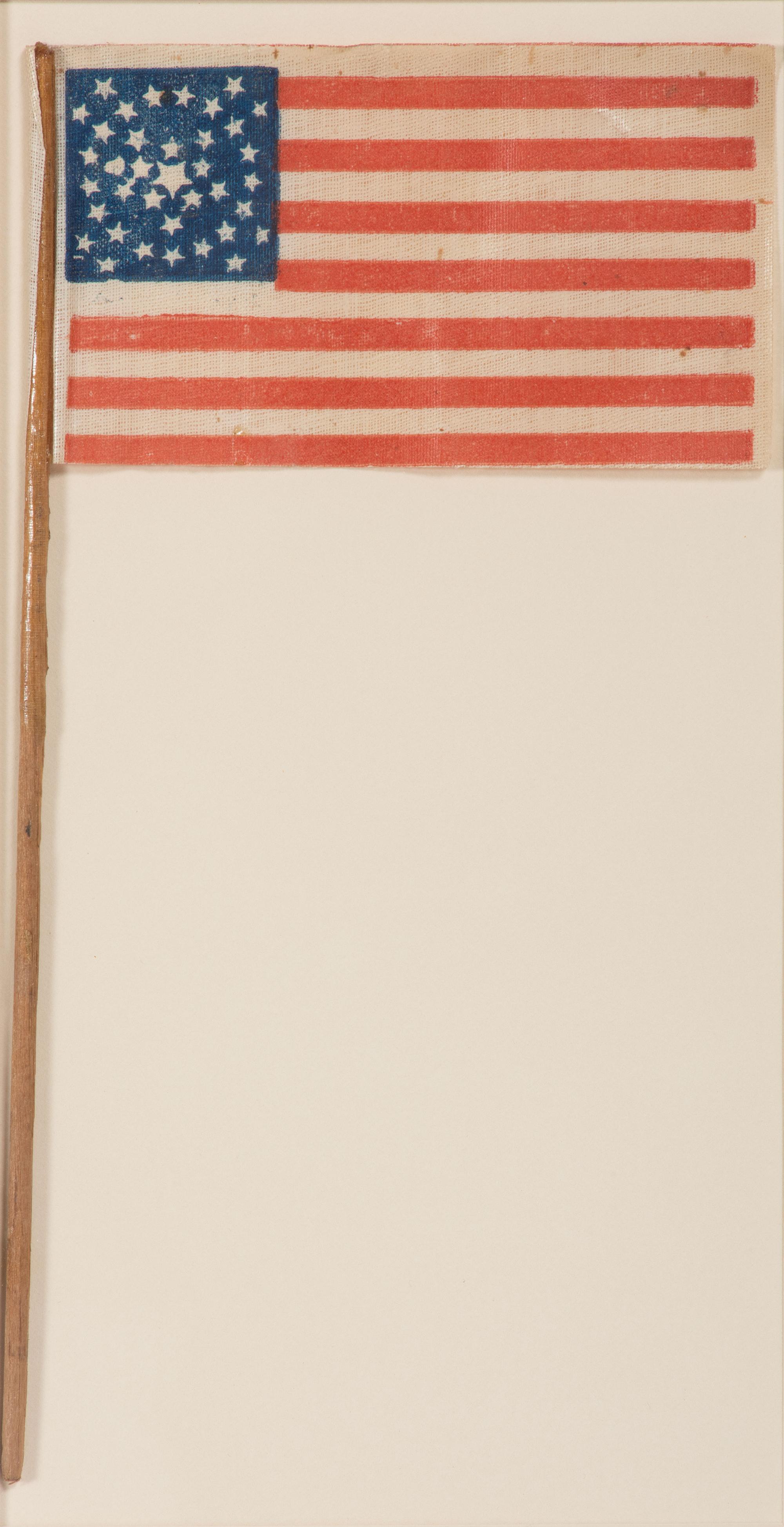 [FLAGS]. 36-star American parade flag in a rare "Great-Star-in-a-Wreath" pattern. Ca 1865-1867.