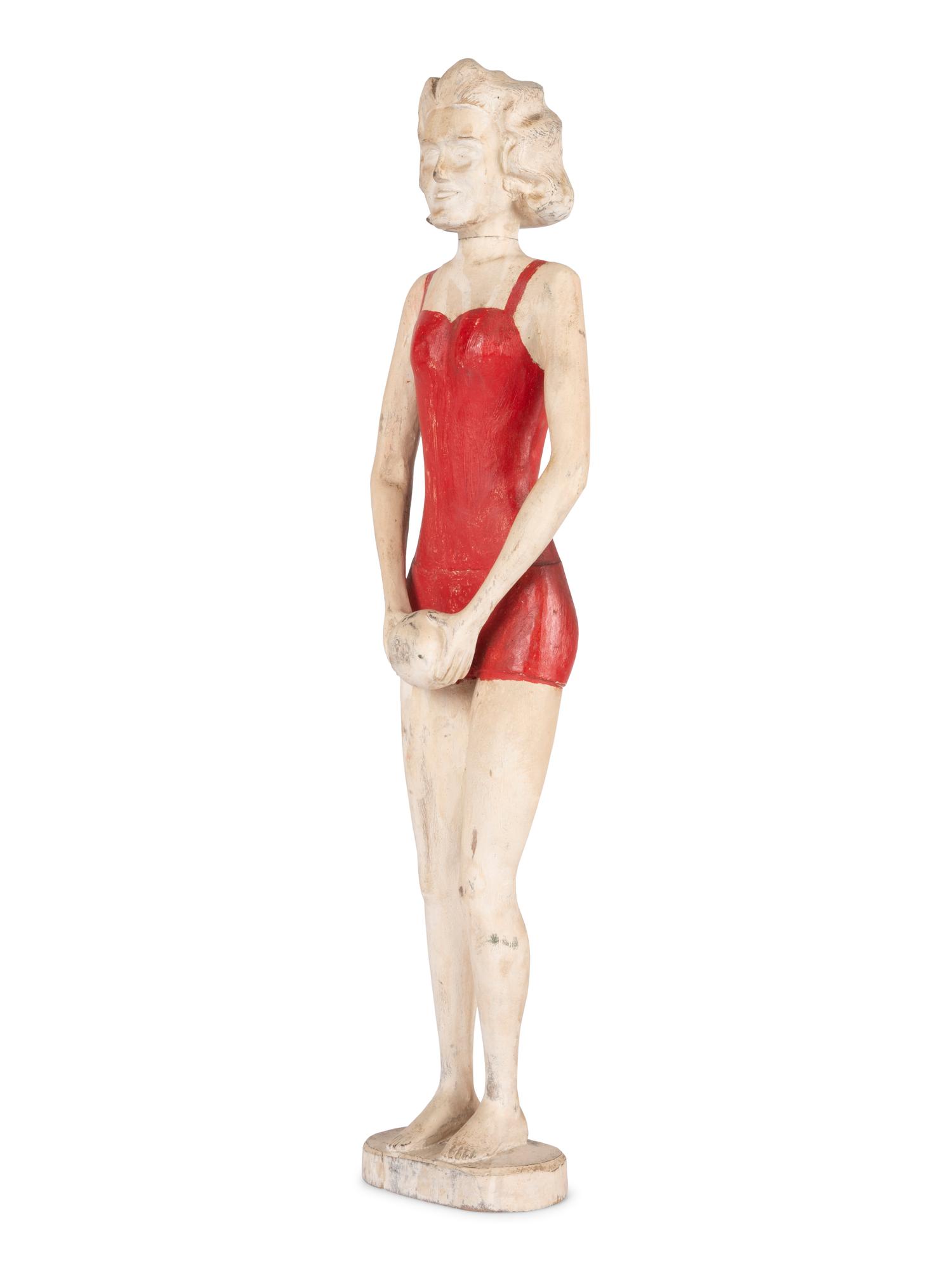 A Carved and Painted Wood Figure of a Bather