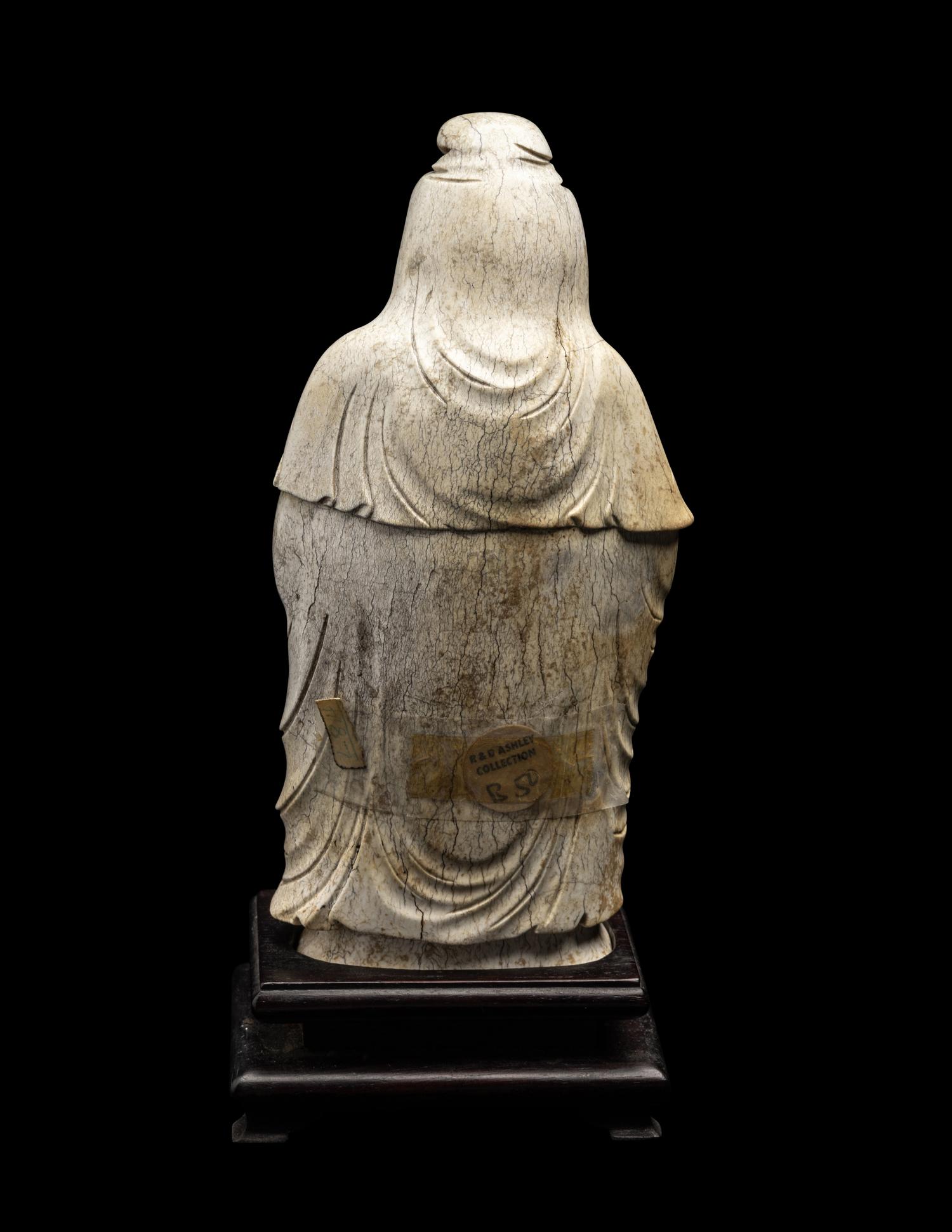 A Chinese Burnt Jade Figure of a Foreigner