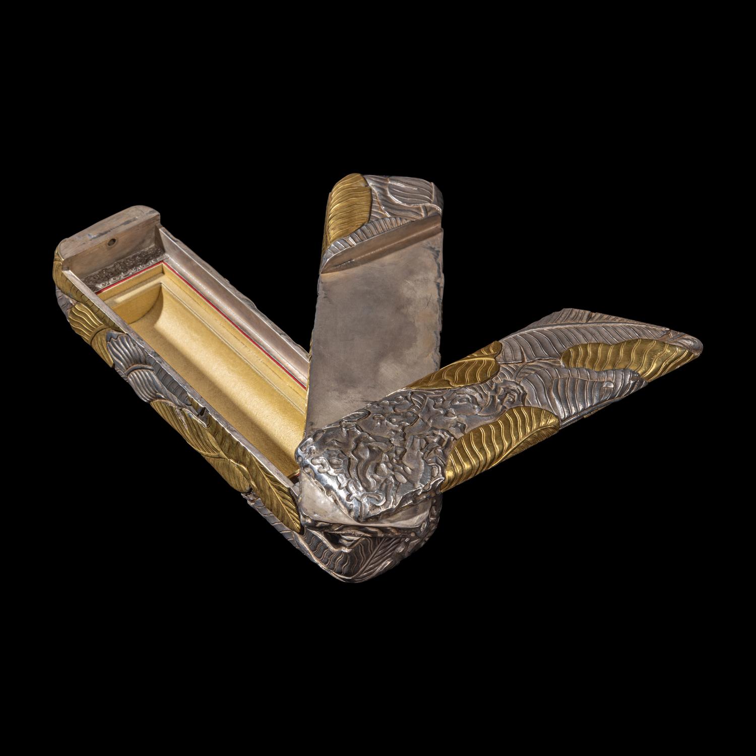 A Chinese Parcel-Gilt Silver Repoussé 'Plantain Leaves' Rectangular Scroll Box, Incised Qianlong Mark 清乾隆乙卯（1796）銀鎏金鏨蕉葉紋手卷機關盒