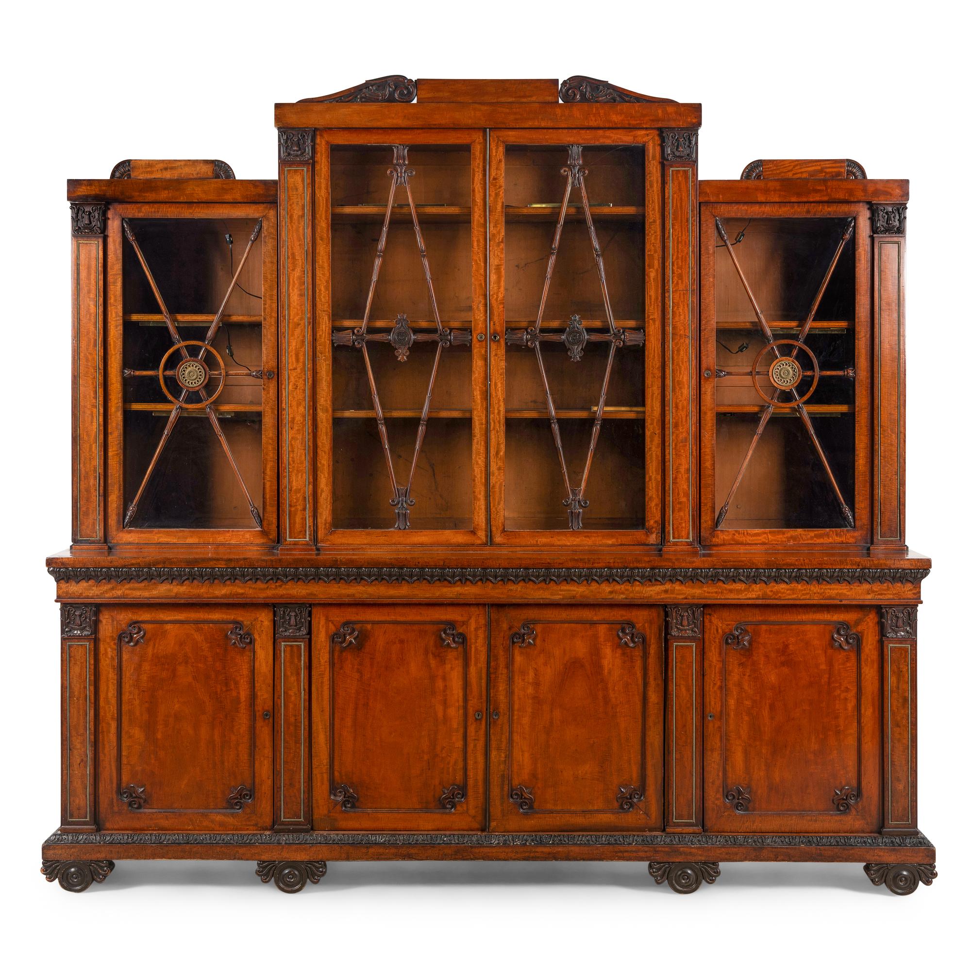 A Regency Mahogany, Ormolu-Mounted and Part Ebonized Breakfront Bookcase