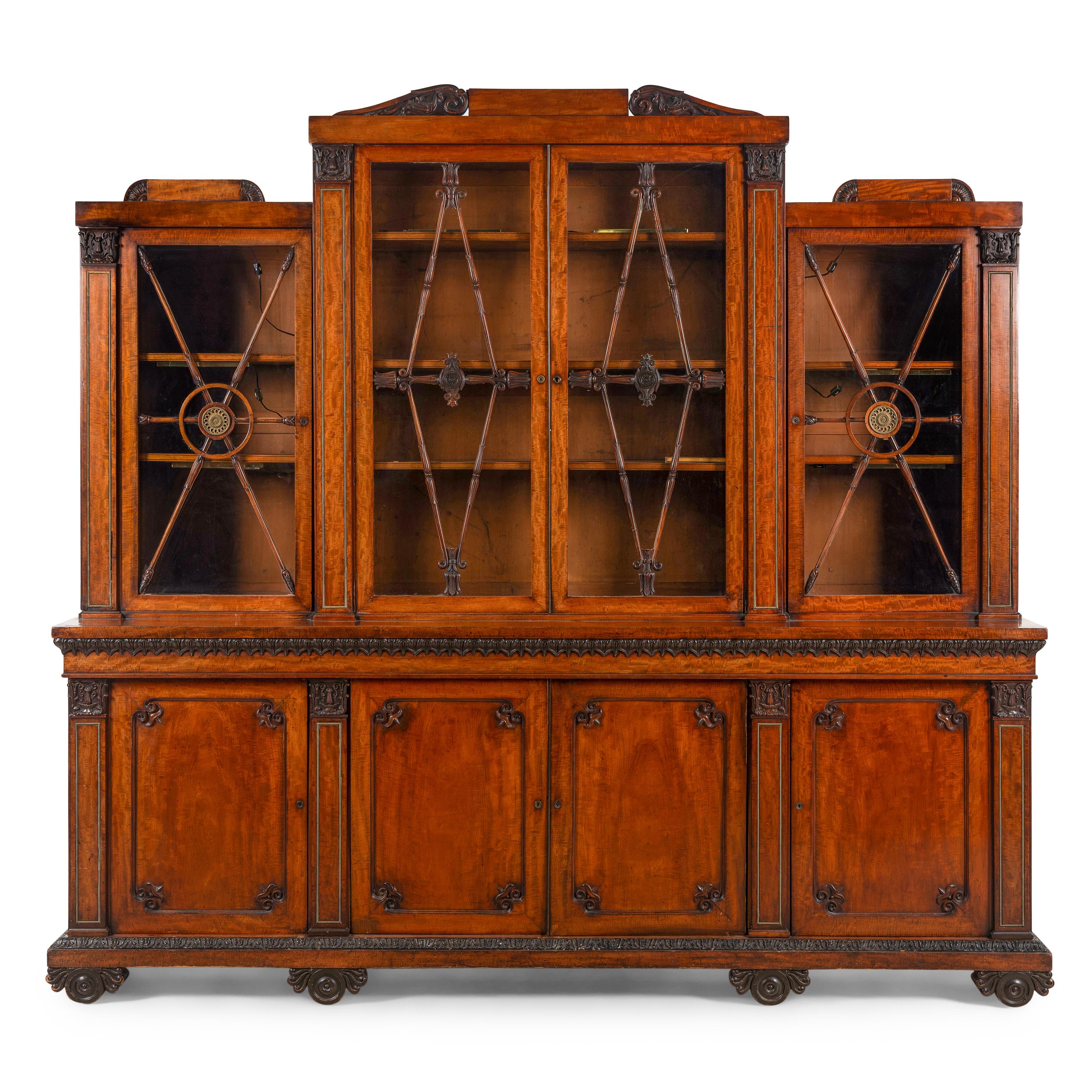 A Regency Mahogany, Ormolu-Mounted and Part Ebonized Breakfront Bookcase