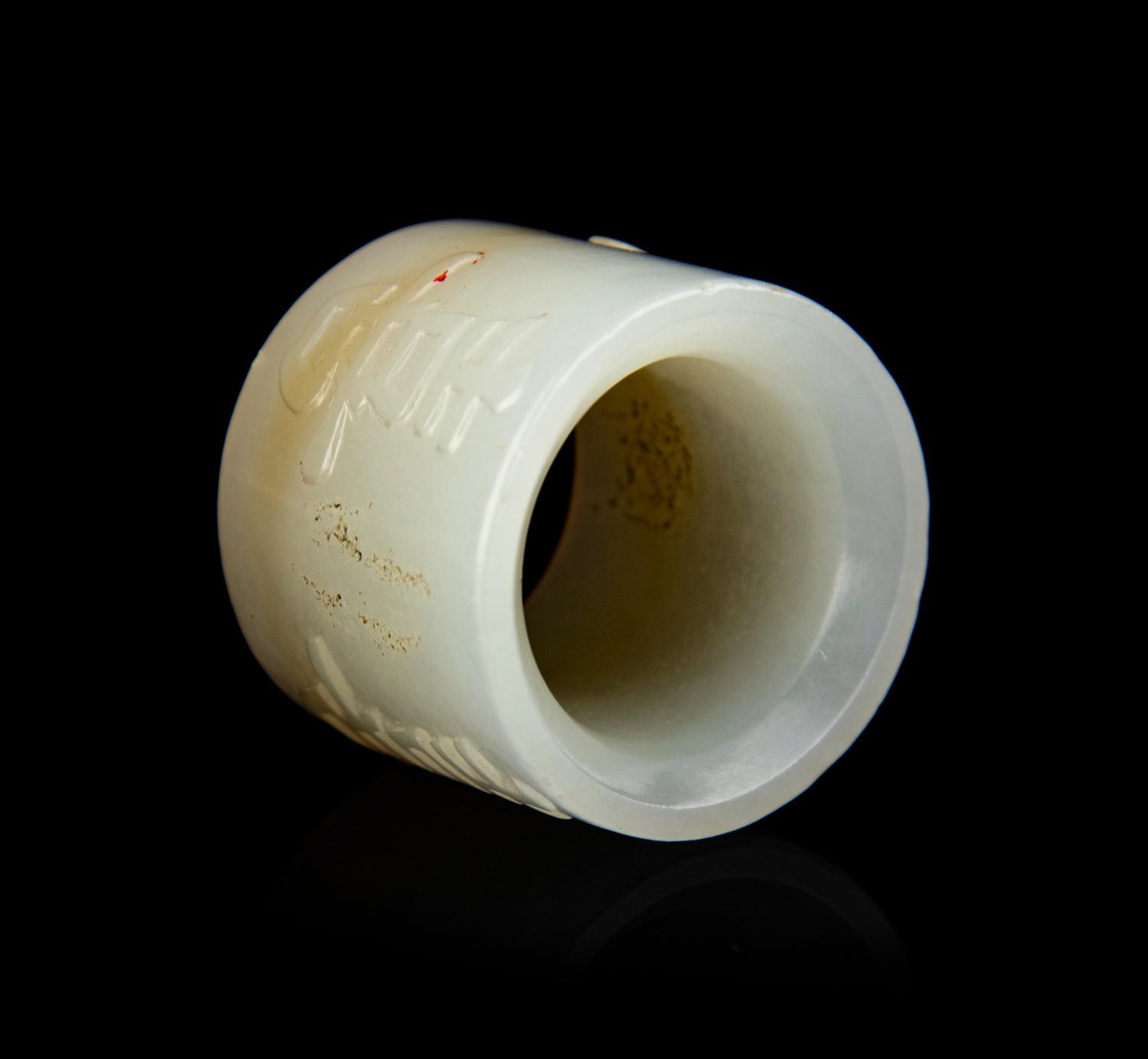 A Chinese White Jade 'Happiness' Archer's Ring