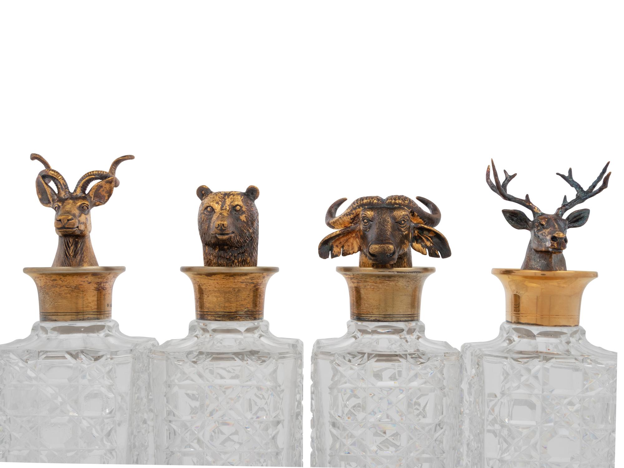 A Set of Four English Silver Mounted Cut-Glass Decanters
