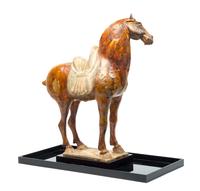 A Straw Glazed Pottery Figure of a Horse Height 21 1/4 inches. — TANG DYNASTY (618-907)