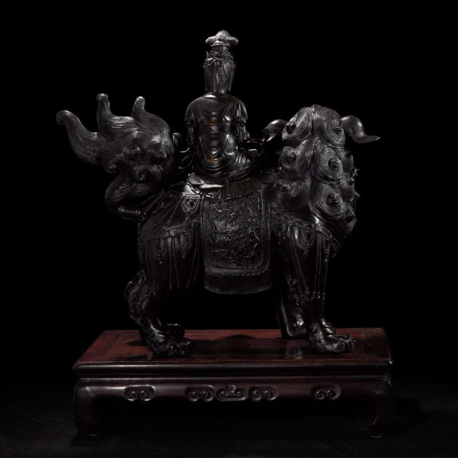A large Japanese patinated bronze figural censer depicting a Bodhisattva on a lion 日本铜加漆菩萨骑狮像 19th/20th century ???????
