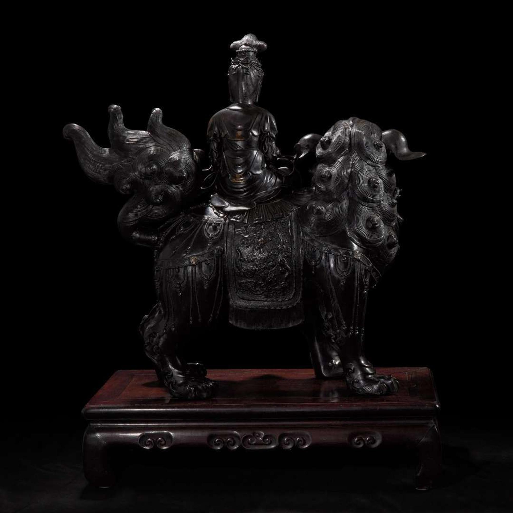 A large Japanese patinated bronze figural censer depicting a Bodhisattva on a lion 日本铜加漆菩萨骑狮像 19th/20th century ???????