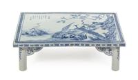 A Blue and White Porcelain Scholar's Table 19TH CENTURY OR EARLIER Height 8 x width 27 5/8 x depth 18 inches. — 19TH CENTURY OR EARLIER