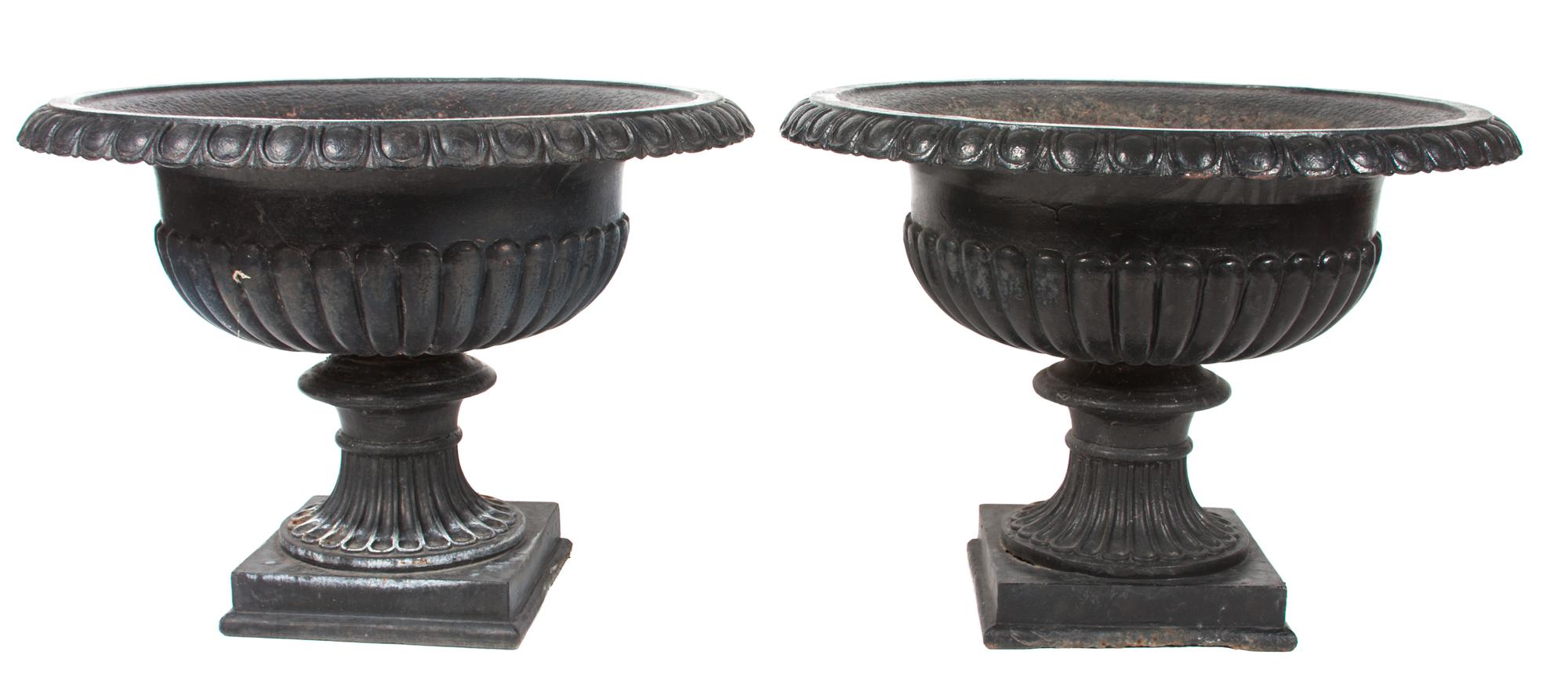 A Pair of Victorian Iron Garden Urns Height of each 22 x diameter 31 inches.