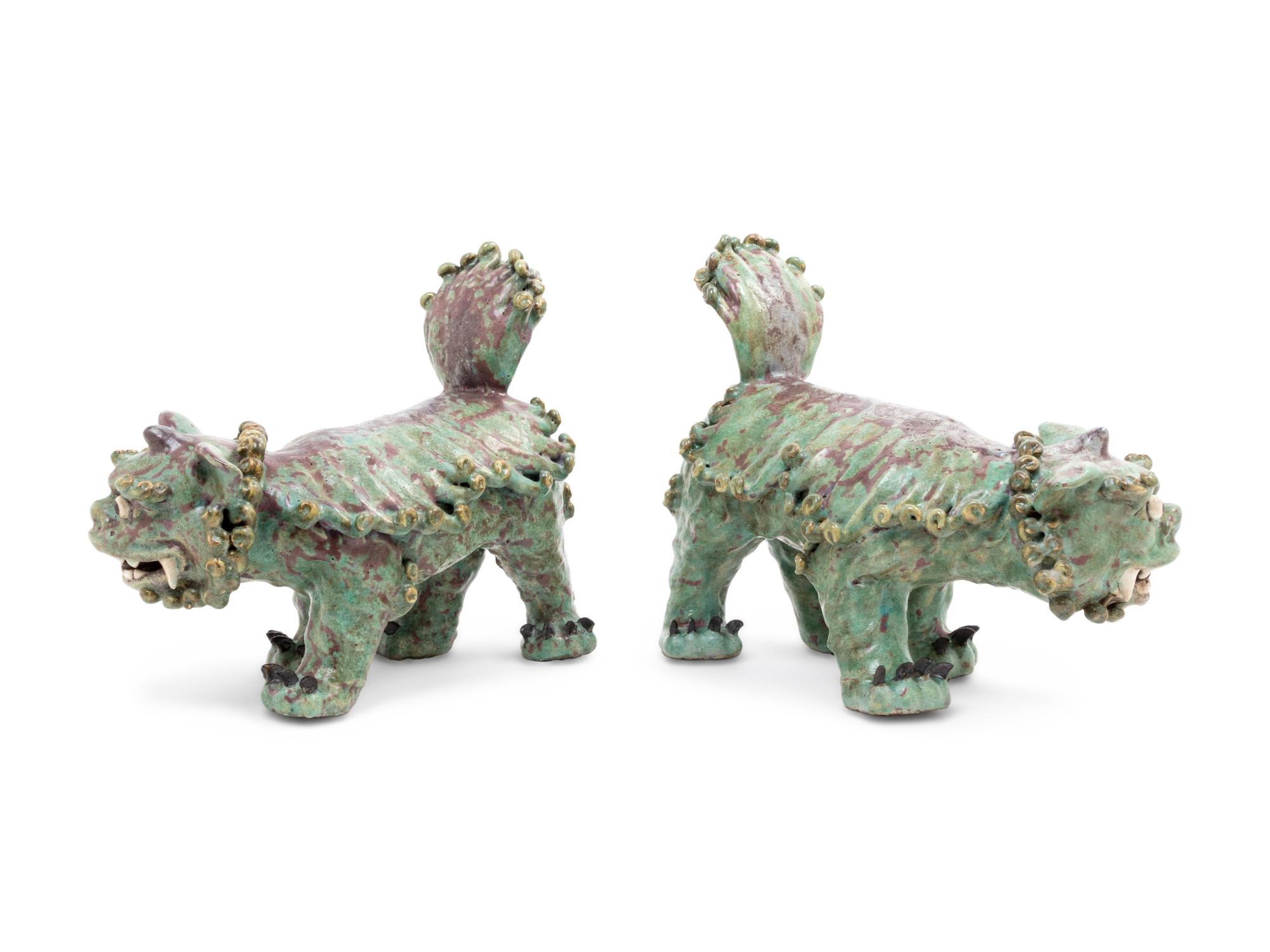 A Pair of Shiwan Red and Green Glazed Stoneware Figures of Fu Lions