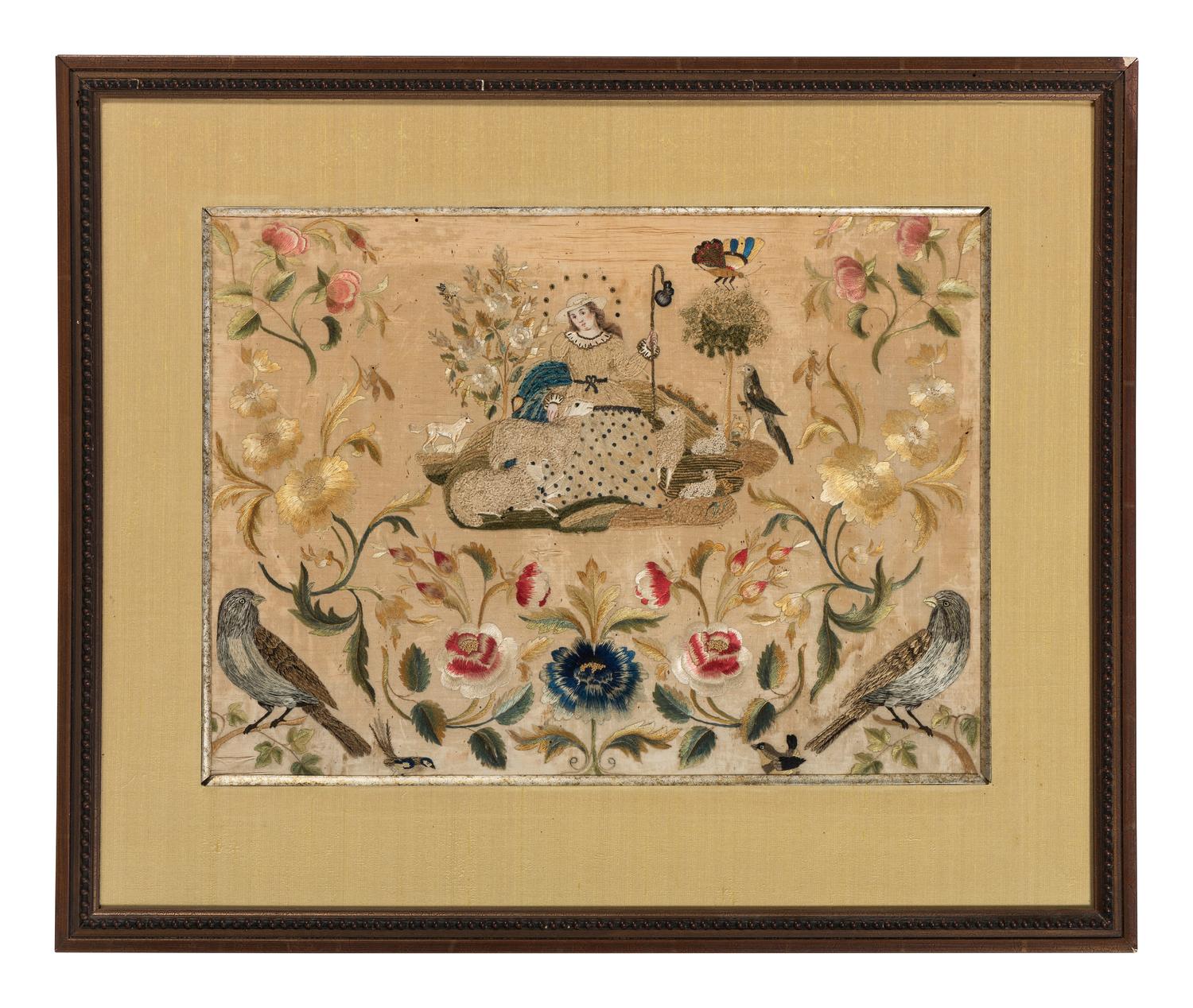 A Needlework Embroidered Picture of a Shepherdess with Flock