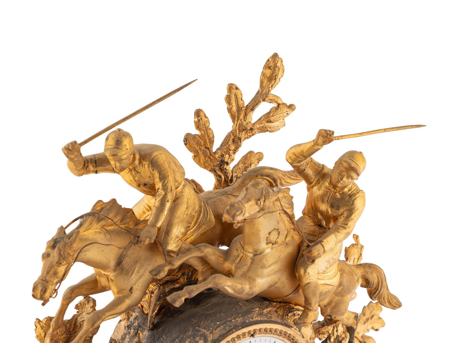 A French Gilt Metal and Alabaster Mantel Clock
