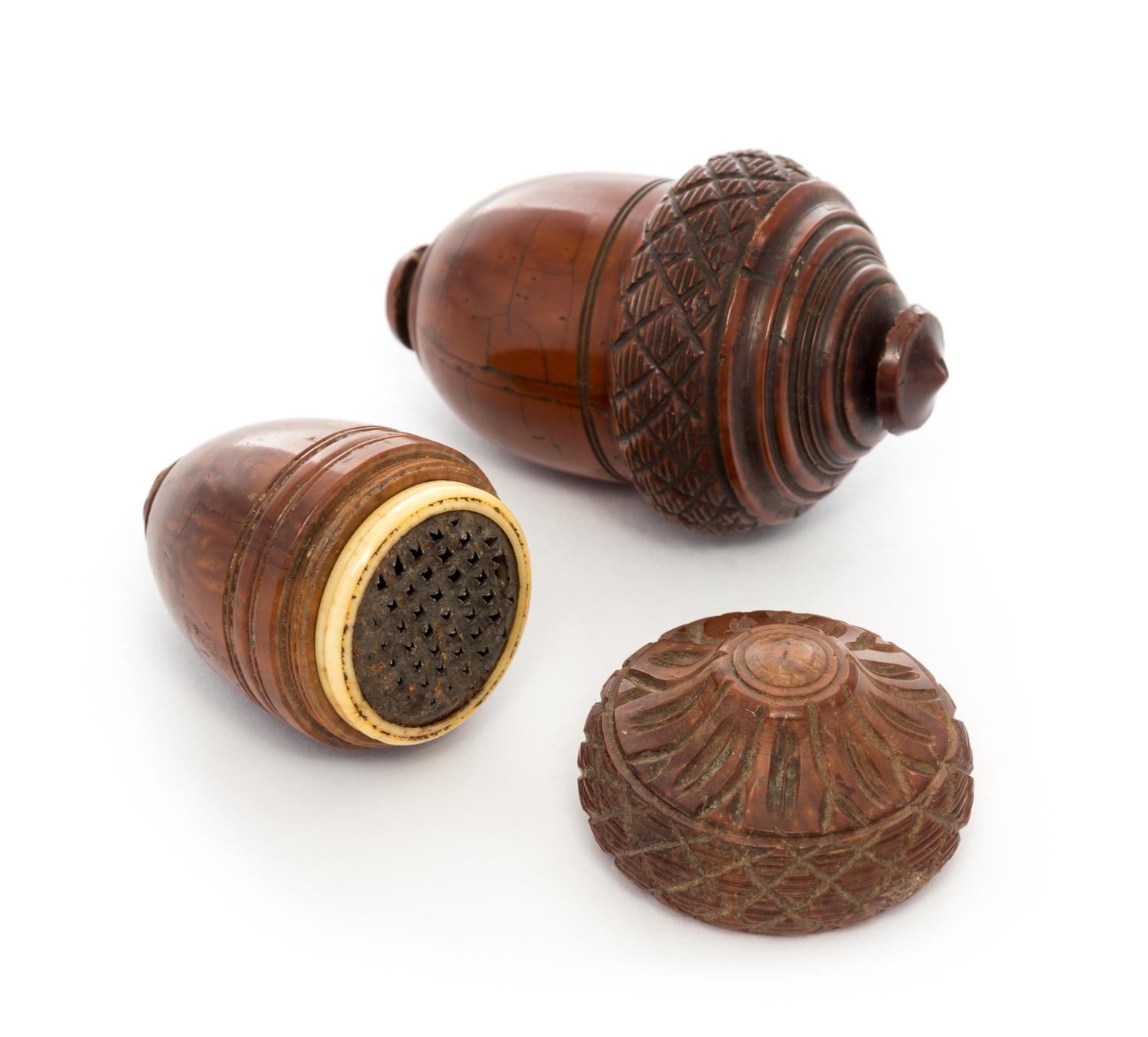 A Matched Pair of Carved Nutmeg Graters Width of larger 3 inches.