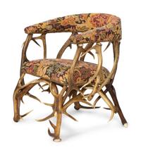 A Tapestry Upholstered Elk Antler Club Chair
