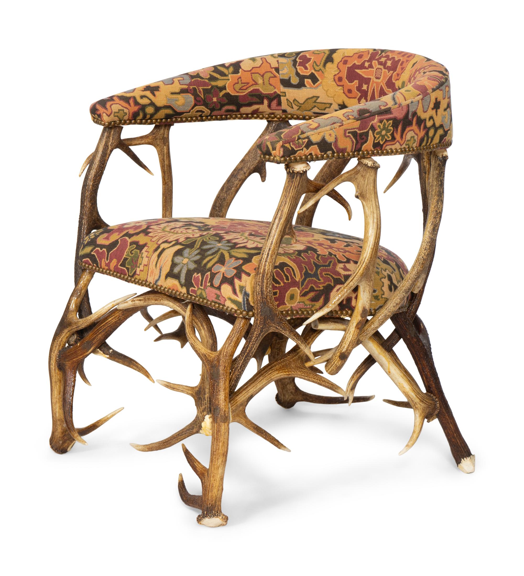 A Tapestry Upholstered Elk Antler Club Chair