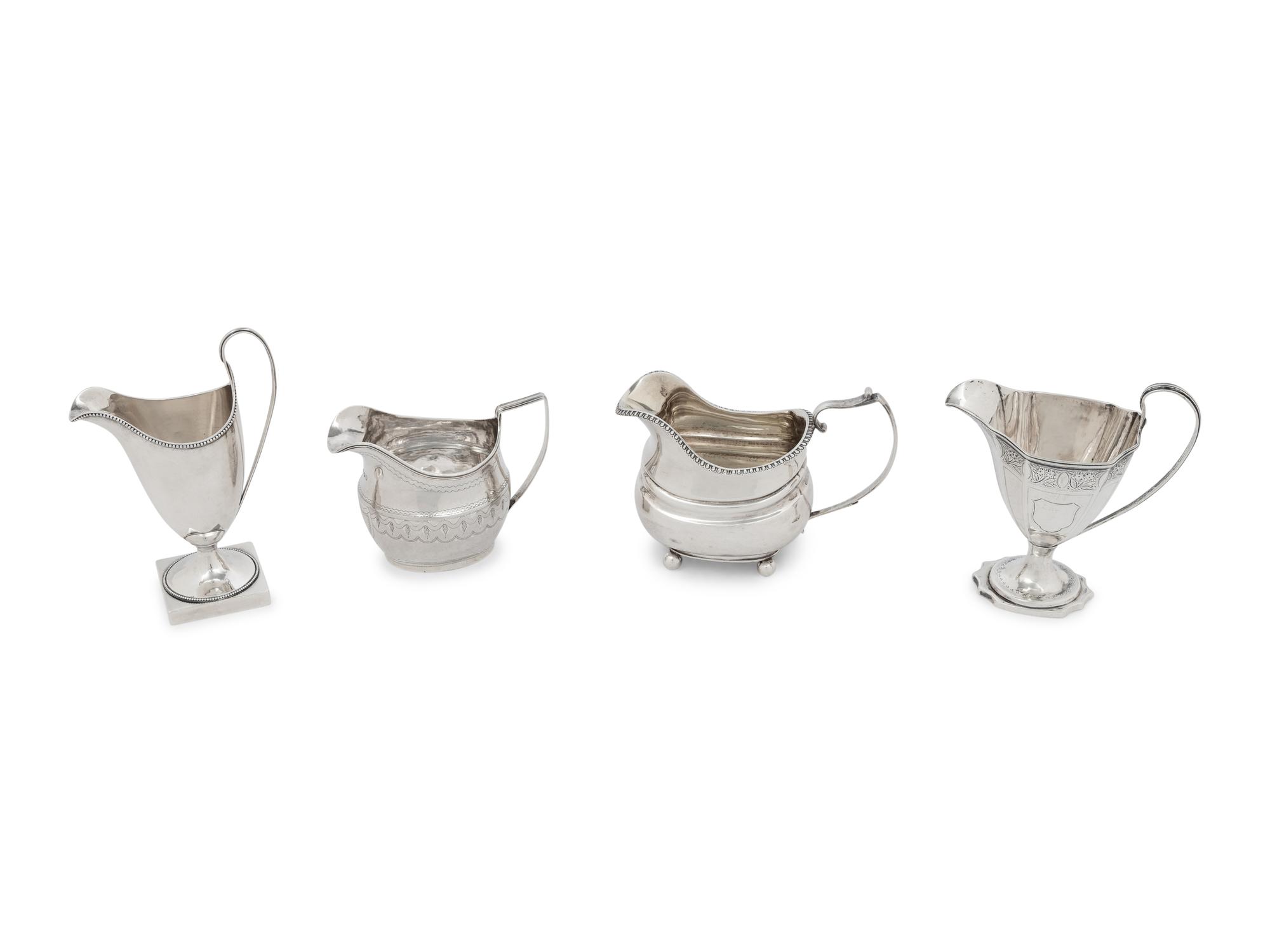 A Group of Four English Silver Creamers
