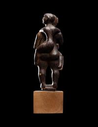An Egyptian Wood Woman Holding Two Children