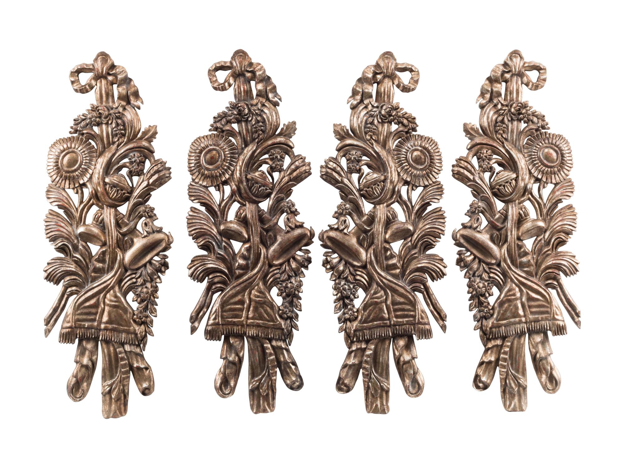 A Set of Four Large Italian Giltwood Trophy Plaques
