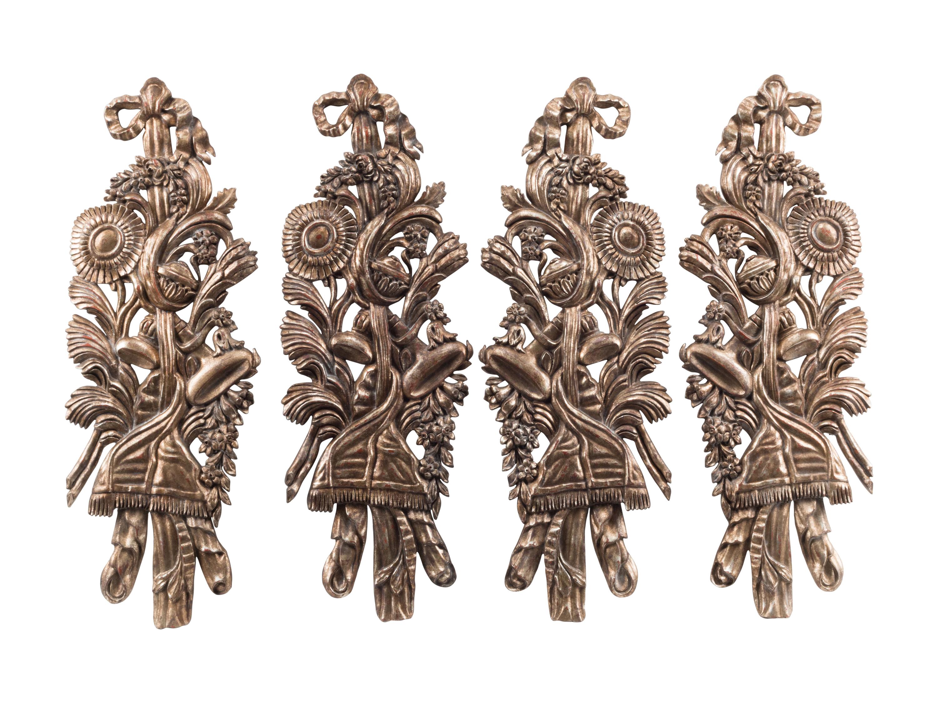 A Set of Four Large Italian Giltwood Trophy Plaques