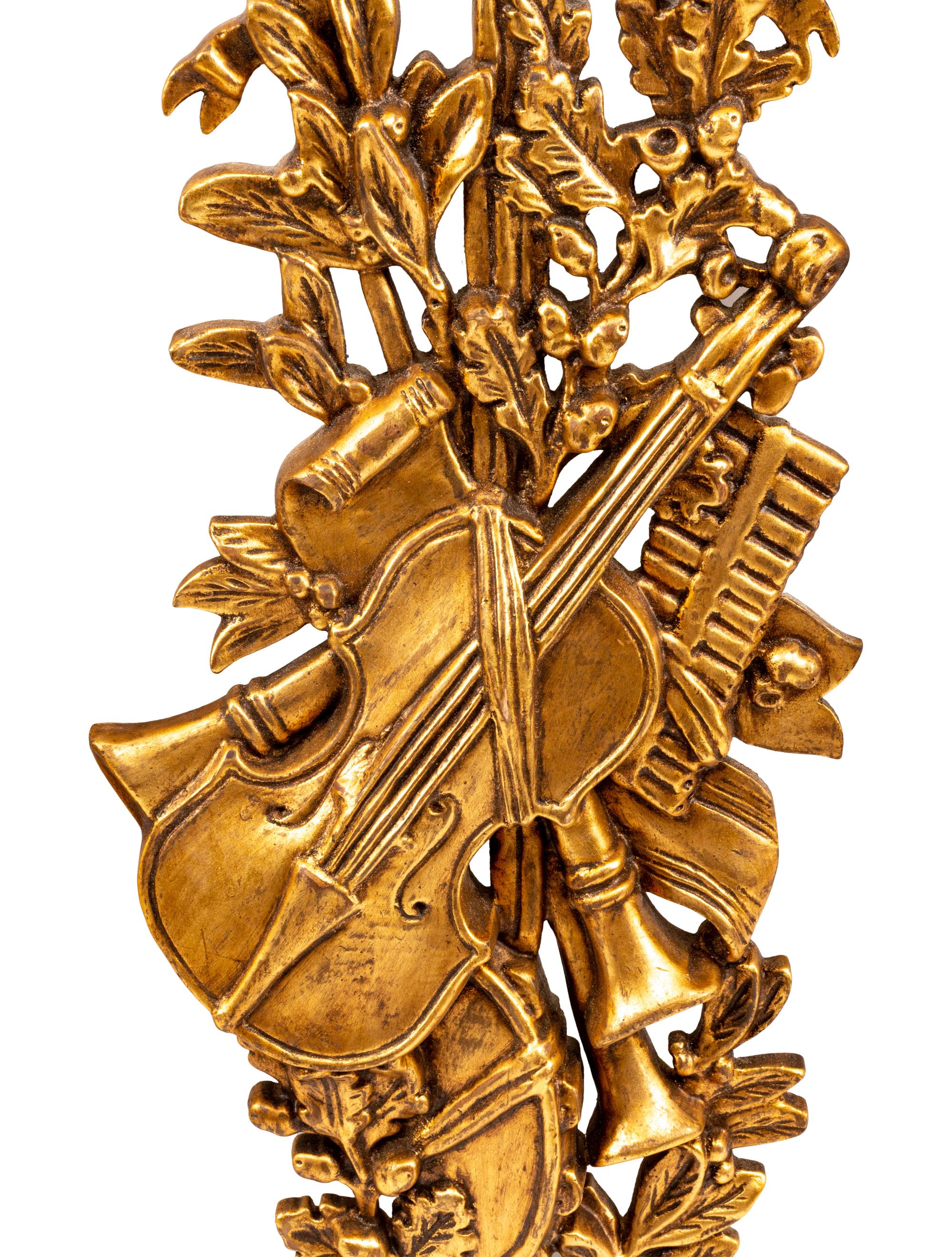 A Set of Four French Giltwood Trophy Appliqués