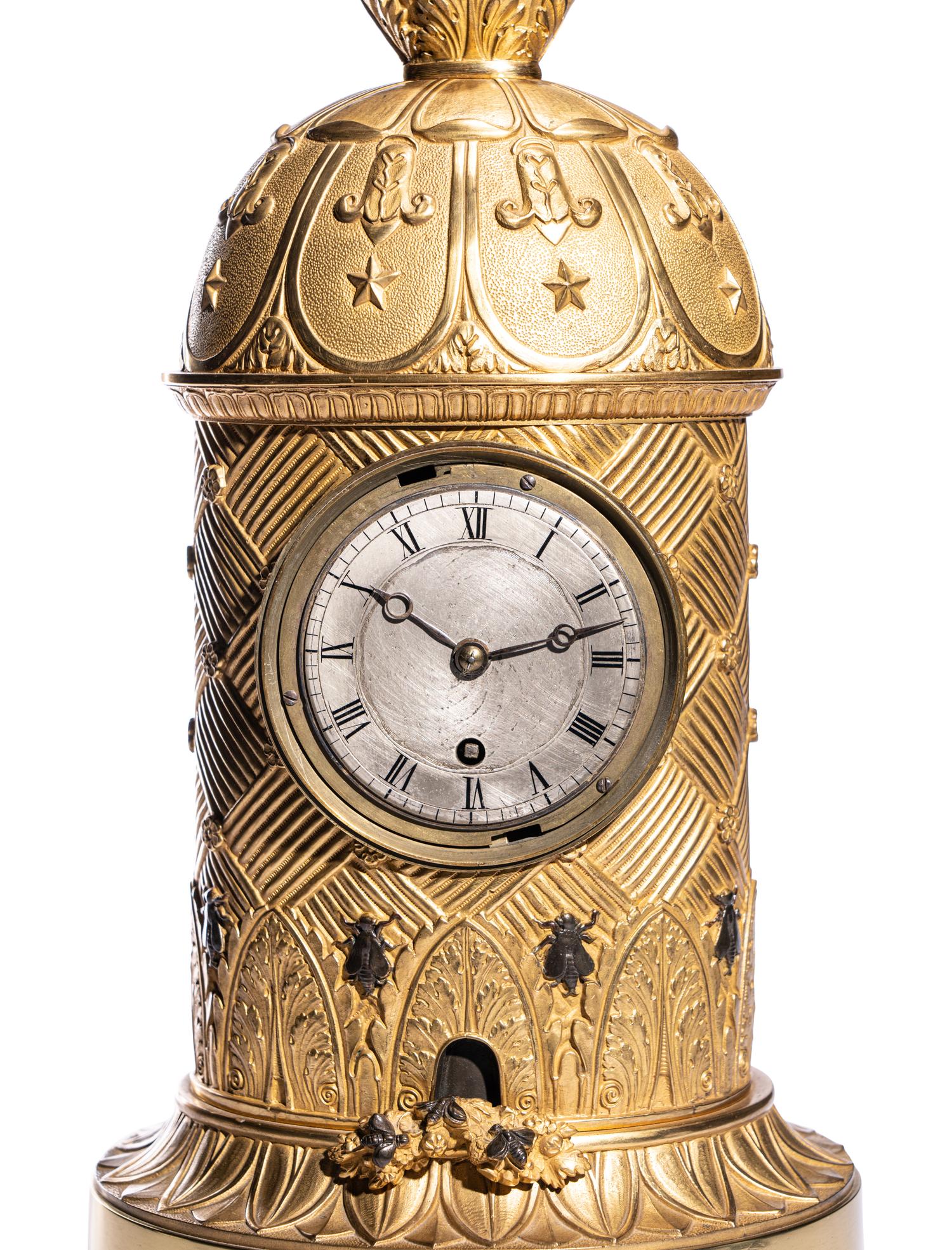 A Charles X Ormolu and Patinated Bronze Beehive Clock