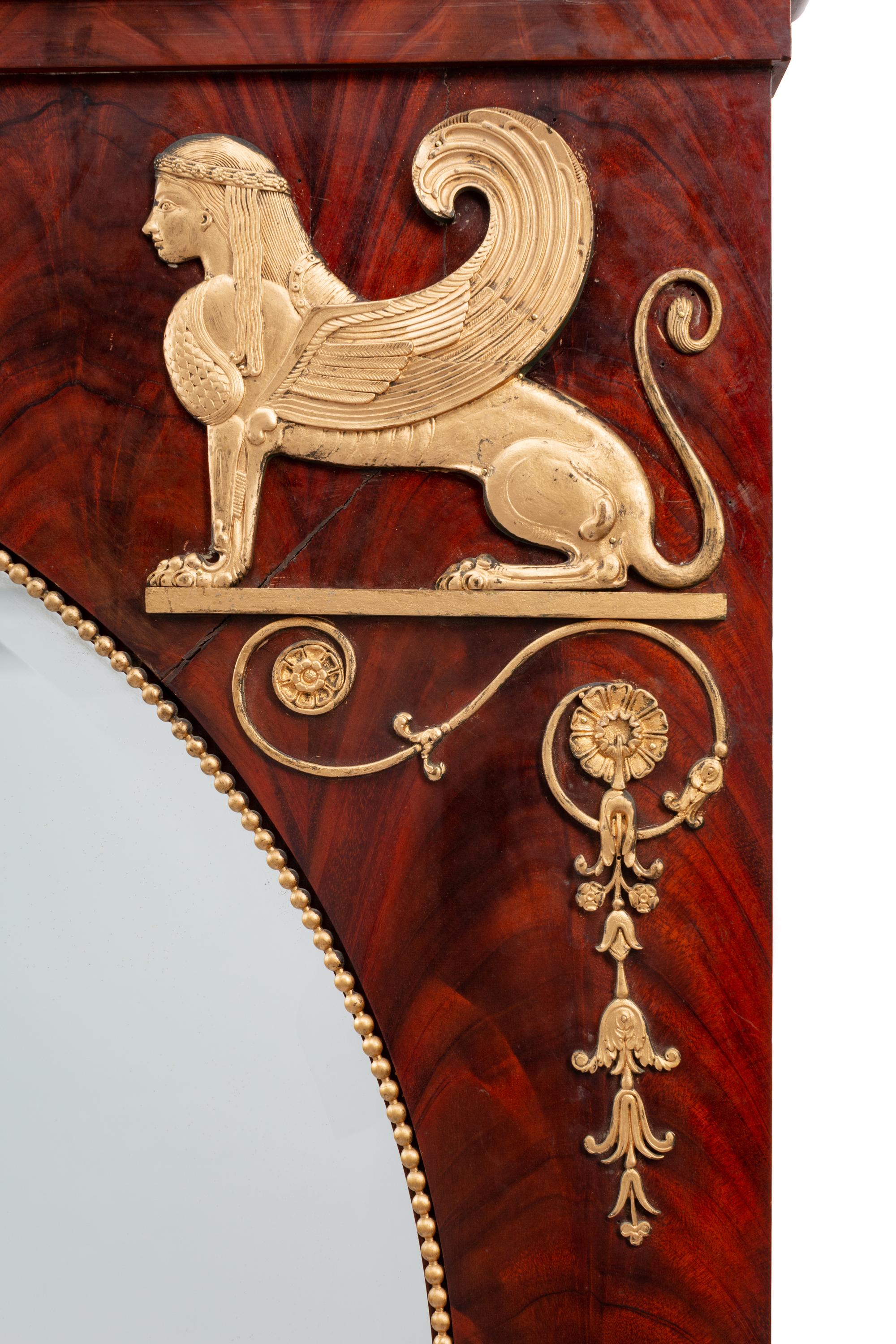 An Empire Style Gilt Metal Mounted Mahogany Mirror