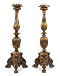 A Pair of Neoclassical Style Parcel Gilt Prickets Height 71 inches.