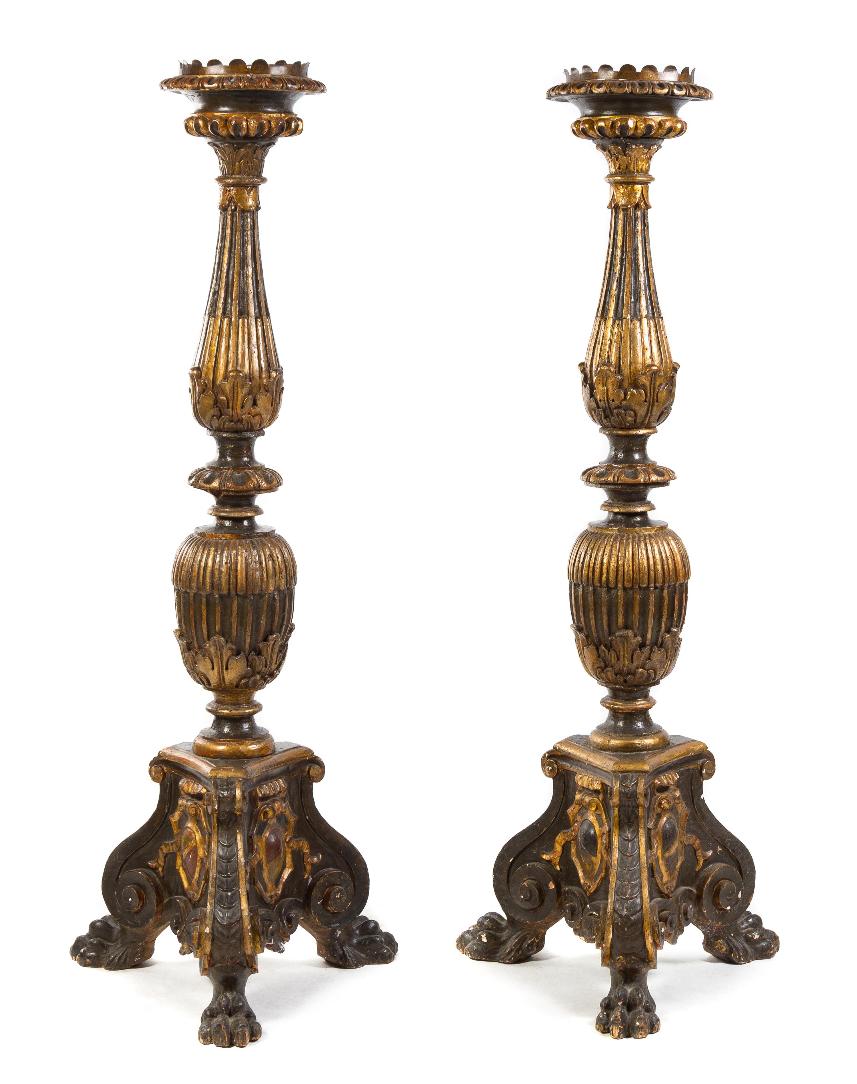 A Pair of Neoclassical Style Parcel Gilt Prickets Height 71 inches.